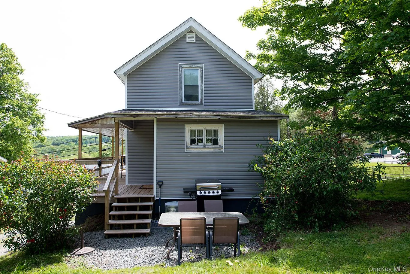 Gray siding exterior with white trim Gray siding exterior with white trim