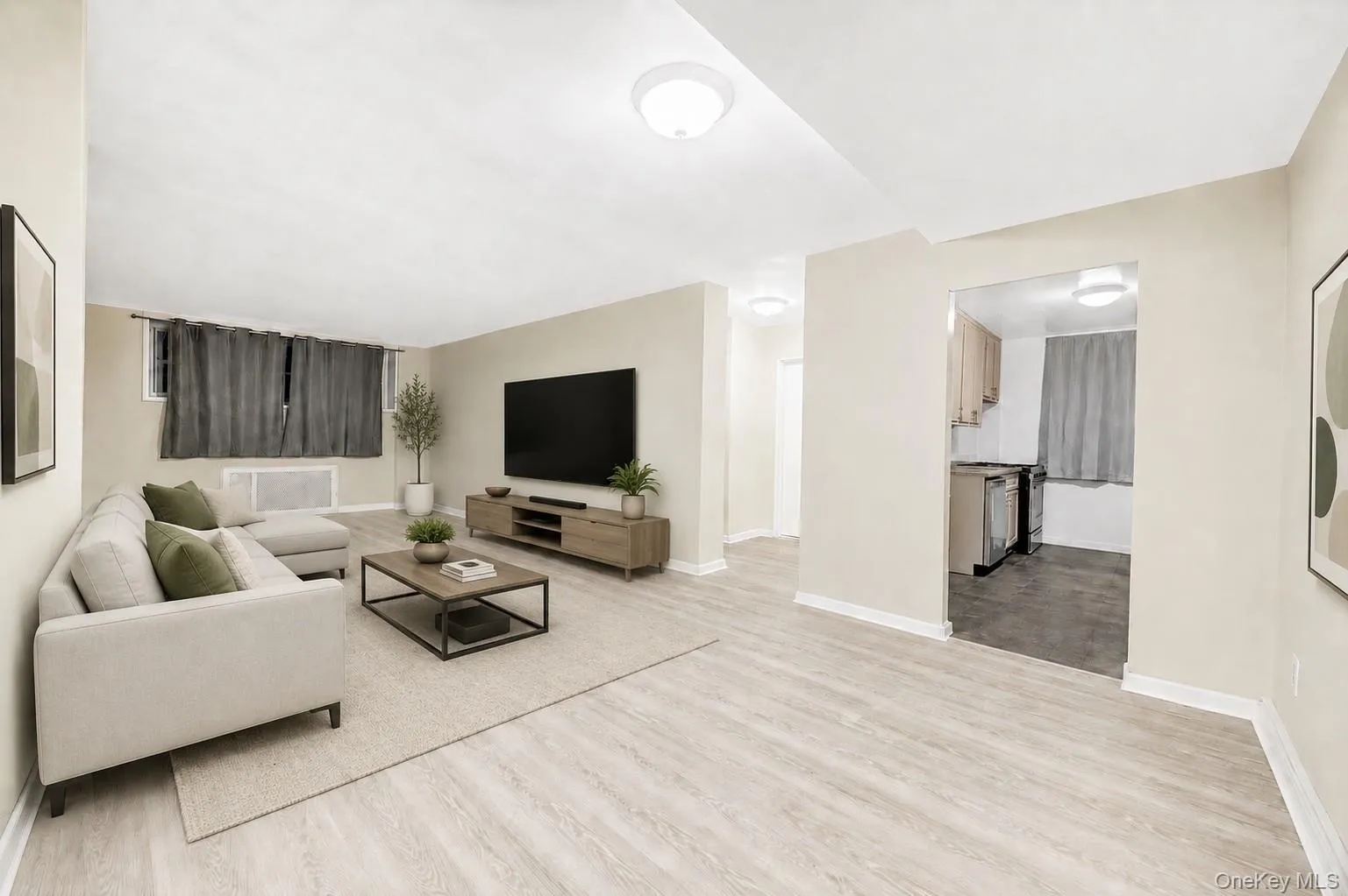 Light wood-finish flooring extending through an open-concept layout Light wood-finish flooring extending through an open-concept layout