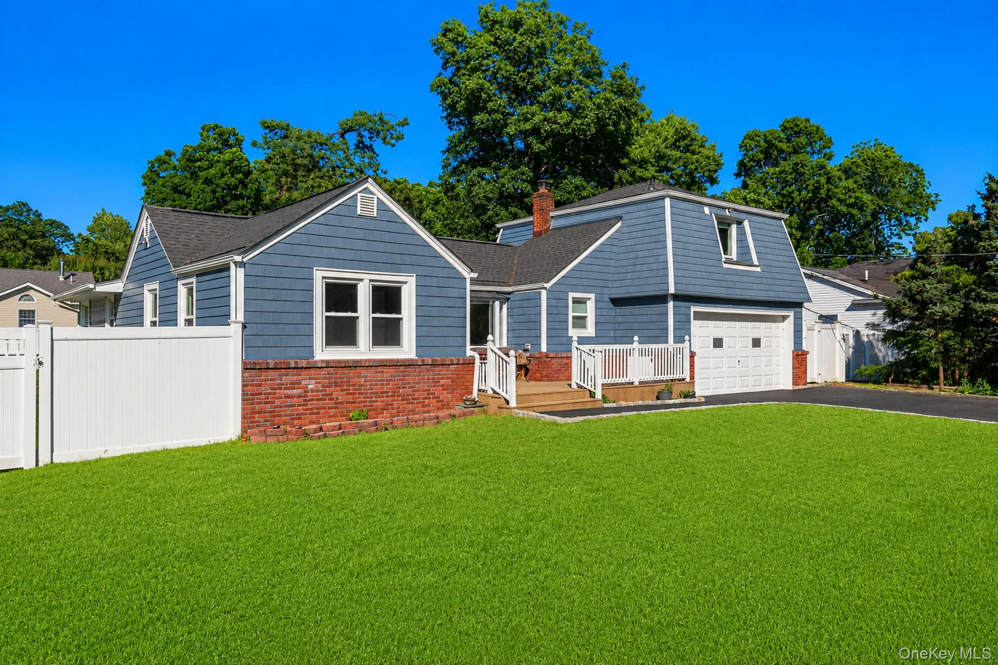 Wonderful Curb Appeal On Beautifully Manicured Fully PVC Fenced Corner Property With A Four Year Old Architectural Roof & Vinyl Siding, Brick Front Trim/Facade & Large Composite/Trex Front Porch With PVC Railings. Wonderful Curb Appeal On Beautifully Manicured Fully PVC Fenced Corner Property With A Four Year Old Architectural Roof & Vinyl Siding, Brick Front Trim/Facade & Large Composite/Trex Front Porch With PVC Railings.