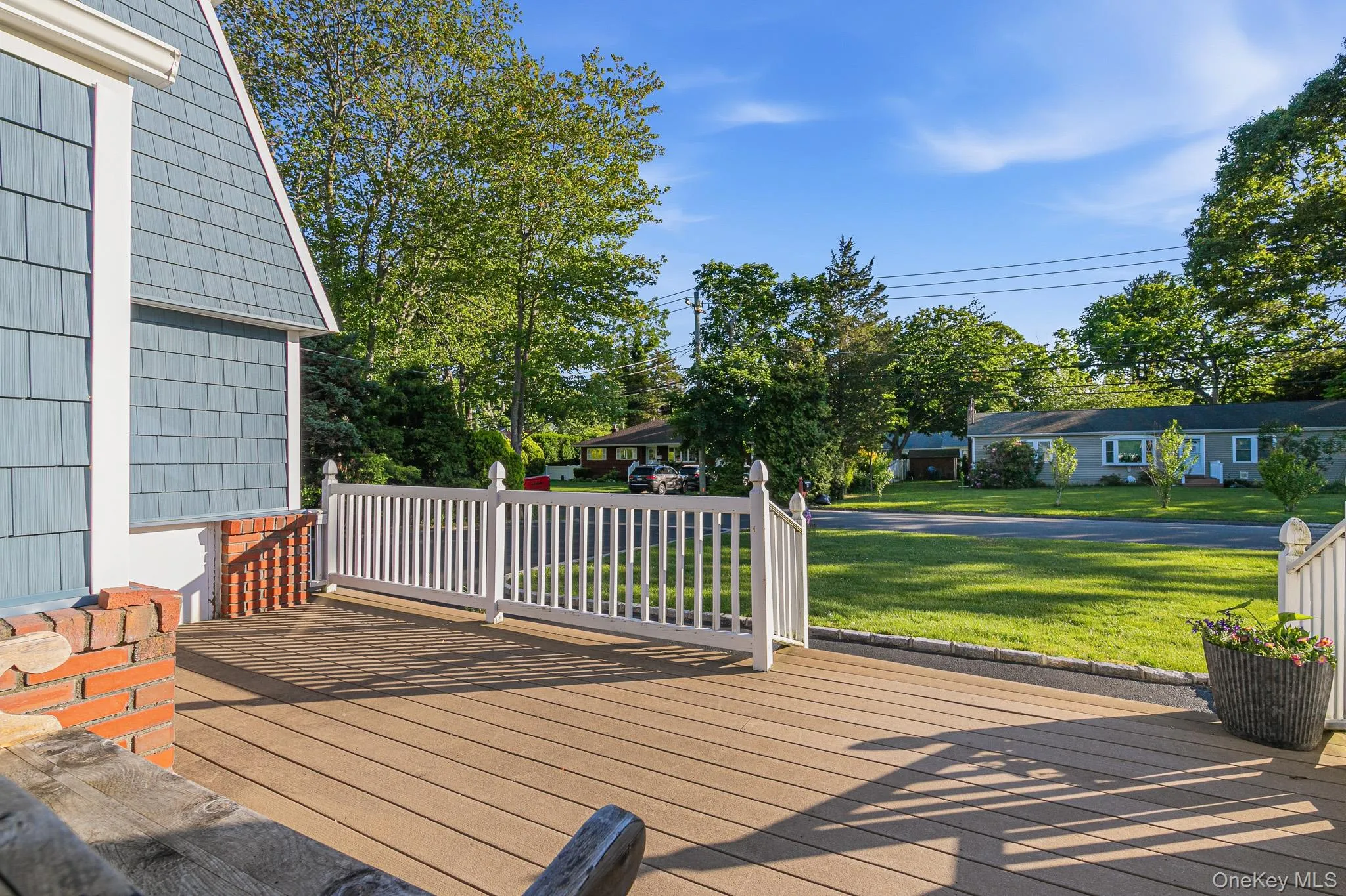 Greeted By A Large Composite/Trex Front Porch With PVC Railings. Perfect For Outdoor Furniture & Welcoming Family, Friends & Guests. Greeted By A Large Composite/Trex Front Porch With PVC Railings. Perfect For Outdoor Furniture & Welcoming Family, Friends & Guests.