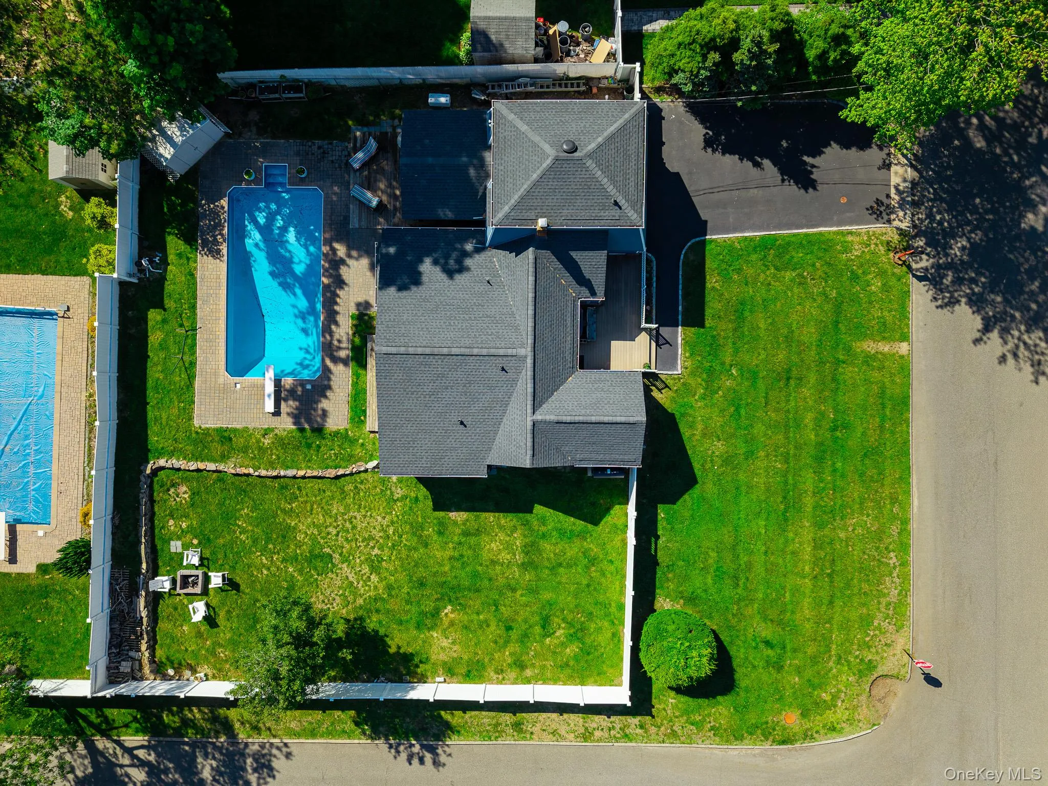 Aerial View Showing The Large Corner Property With A Very Large, Fully PVC Fenced Backyard & The Saltwater In Ground Pool. Aerial View Showing The Large Corner Property With A Very Large, Fully PVC Fenced Backyard & The Saltwater In Ground Pool.