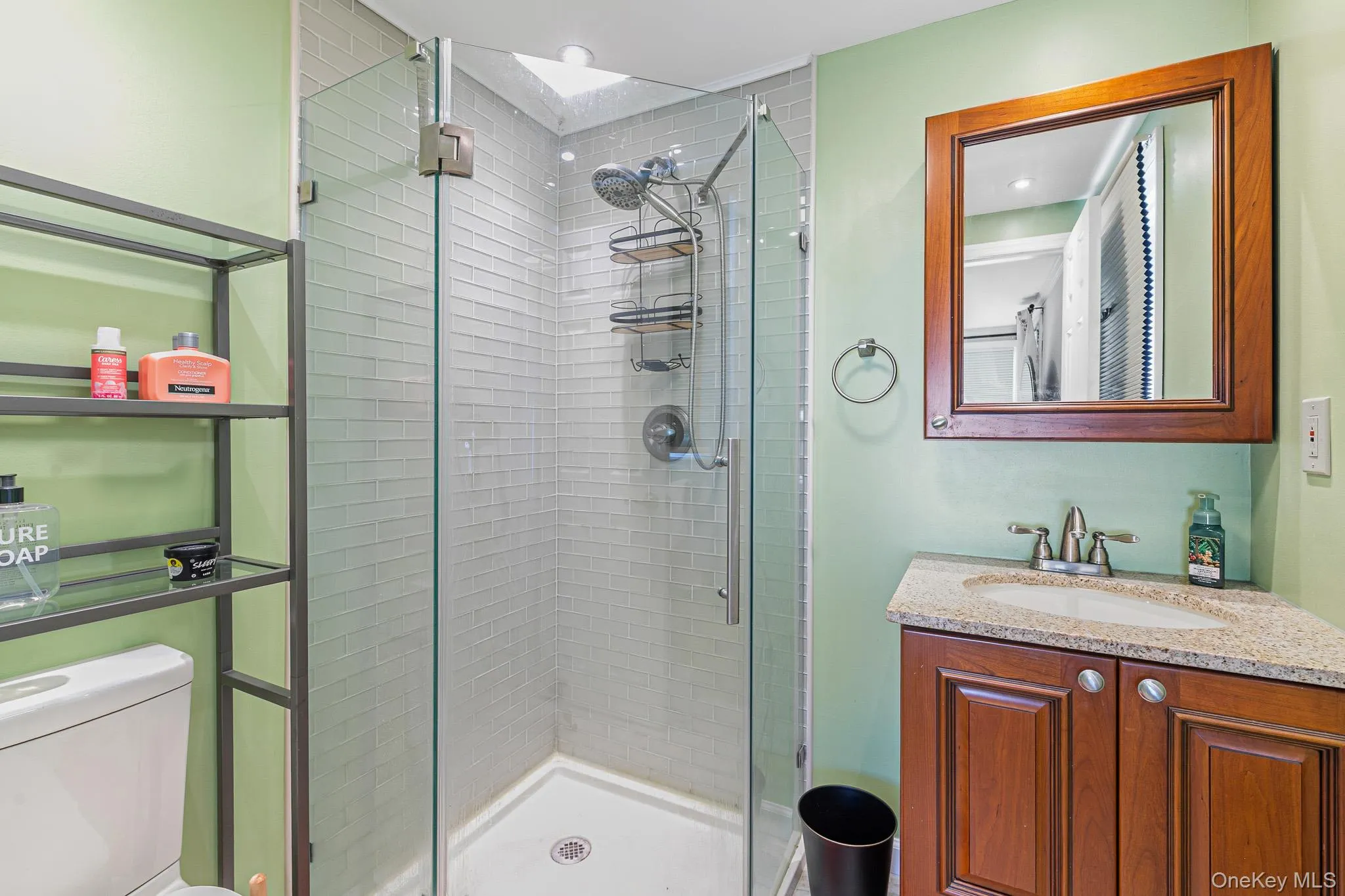 The Beautifully Renovated Second Full Bathroom (En Suite Off Of The Third Bedroom) Offers A Custom Corner Shower With All Subway Tiled Walls, Frameless Glass Doors, Ceramic Tiled Floor, Granite Topped Vanity & All Upgraded Fixtures. The Beautifully Renovated Second Full Bathroom (En Suite Off Of The Third Bedroom) Offers A Custom Corner Shower With All Subway Tiled Walls, Frameless Glass Doors, Ceramic Tiled Floor, Granite Topped Vanity & All Upgraded Fixtures.