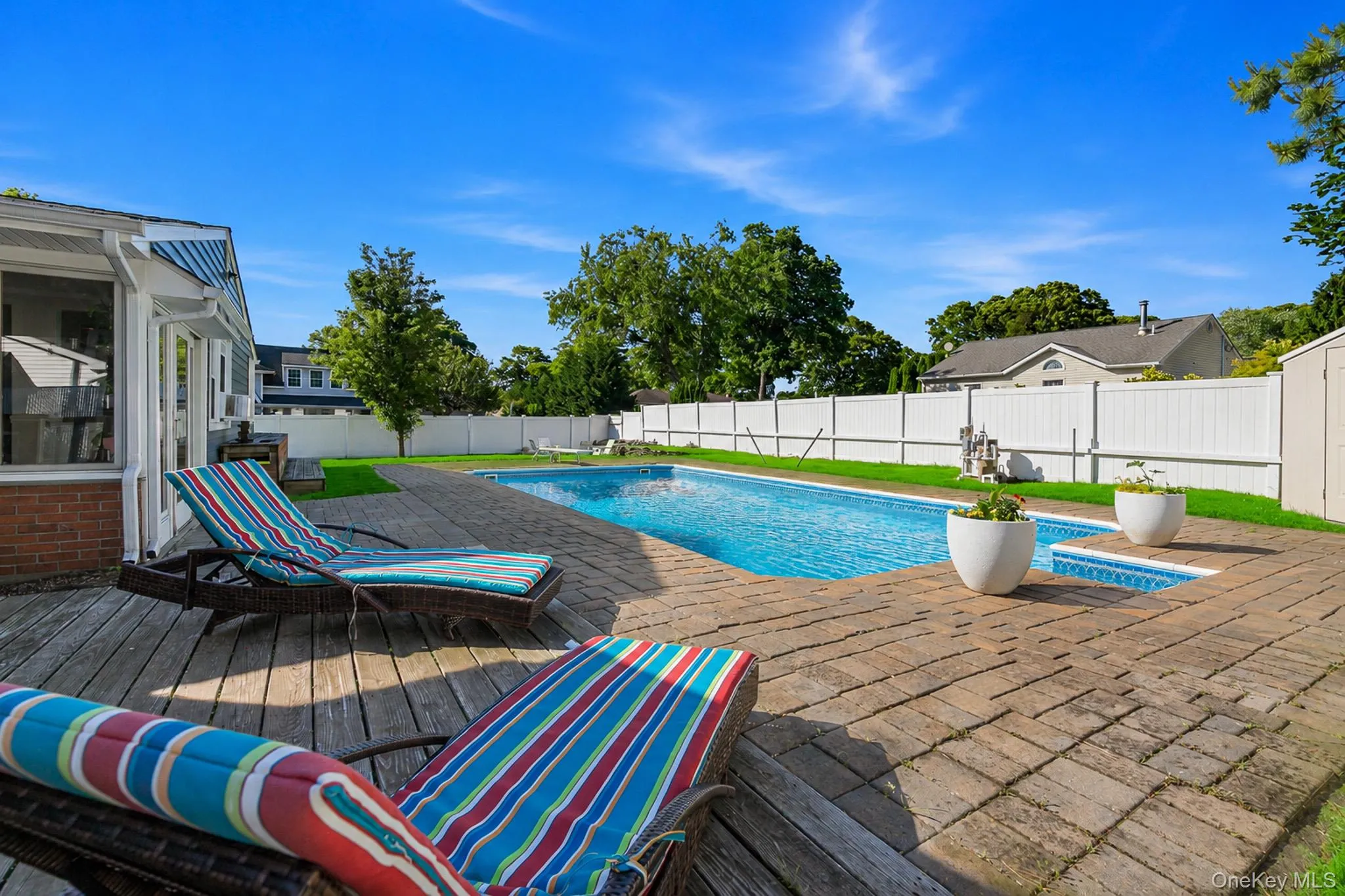 The Spectacular Entertainer's Backyard Offers A Saltwater In Ground Pool With A Diving Board, Expansive Paver Patios & Paver Pool Surround, And The Pool Is Always Warm Because Of Constant Direct Sunlight. The Spectacular Entertainer's Backyard Offers A Saltwater In Ground Pool With A Diving Board, Expansive Paver Patios & Paver Pool Surround, And The Pool Is Always Warm Because Of Constant Direct Sunlight.
