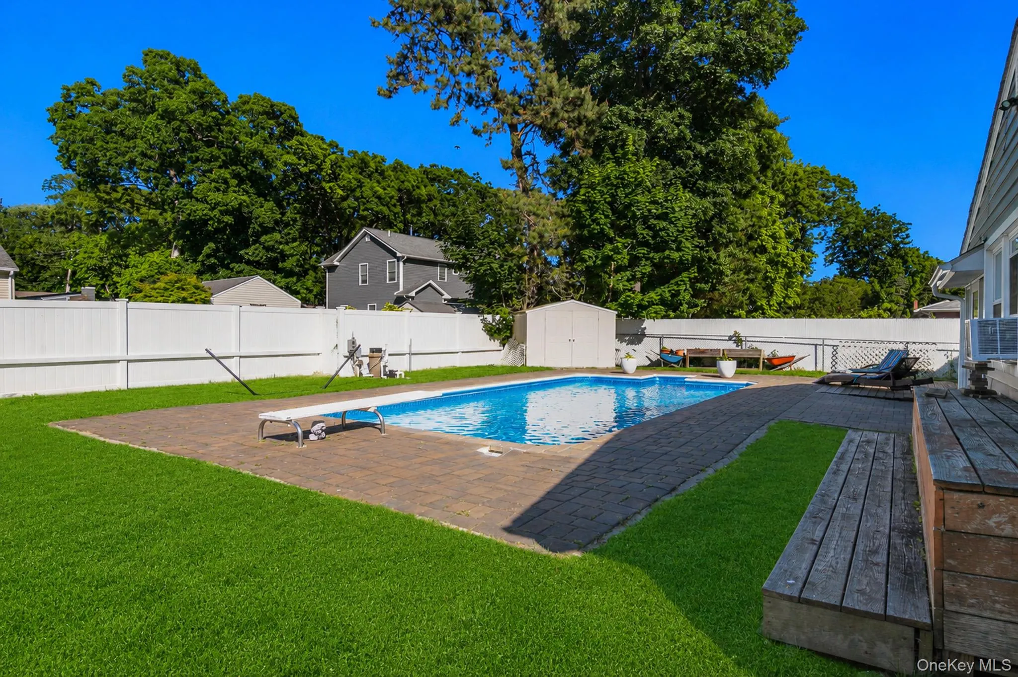 The Spectacular Entertainer's Backyard Offers A Saltwater In Ground Pool With A Diving Board, Expansive Paver Patios & Paver Pool Surround, And The Pool Is Always Warm Because Of Constant Direct Sunlight. The Spectacular Entertainer's Backyard Offers A Saltwater In Ground Pool With A Diving Board, Expansive Paver Patios & Paver Pool Surround, And The Pool Is Always Warm Because Of Constant Direct Sunlight.