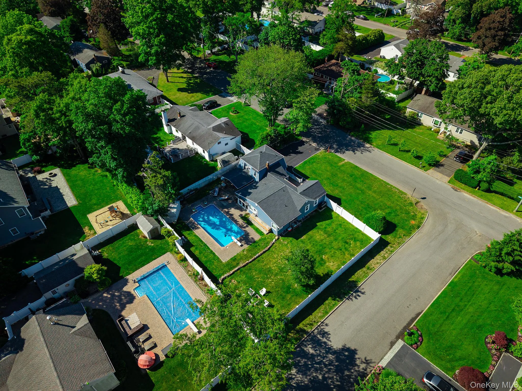 Aerial View Showing The Large Corner Property With A Very Large, Fully PVC Fenced Backyard & The Saltwater In Ground Pool. Aerial View Showing The Large Corner Property With A Very Large, Fully PVC Fenced Backyard & The Saltwater In Ground Pool.