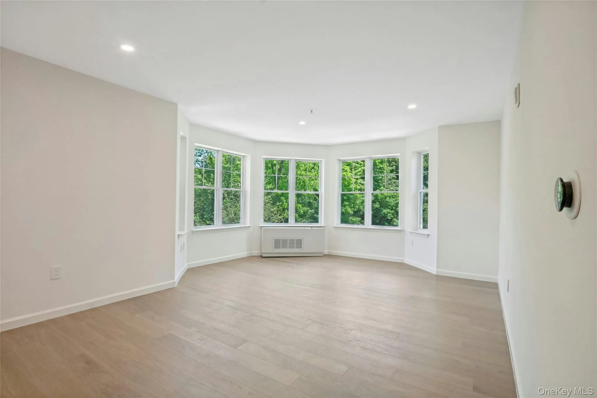 Dining area leads to living room with turreted bay window alcove Dining area leads to living room with turreted bay window alcove