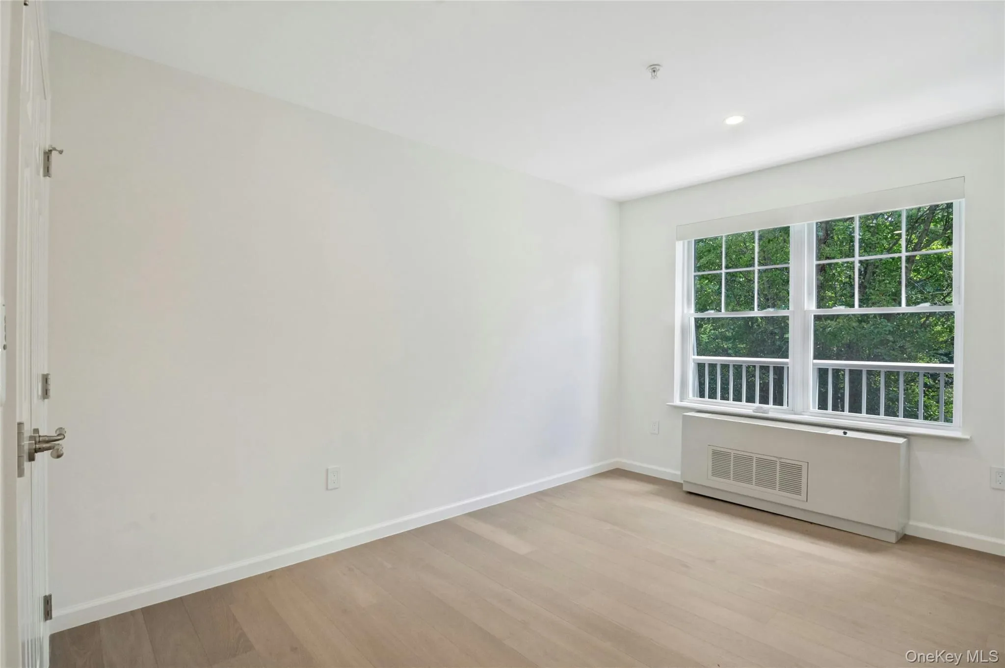 Bedroom with dimmable overhead lighting, wood floors, large closet and remote controlled motorized shades Bedroom with dimmable overhead lighting, wood floors, large closet and remote controlled motorized shades