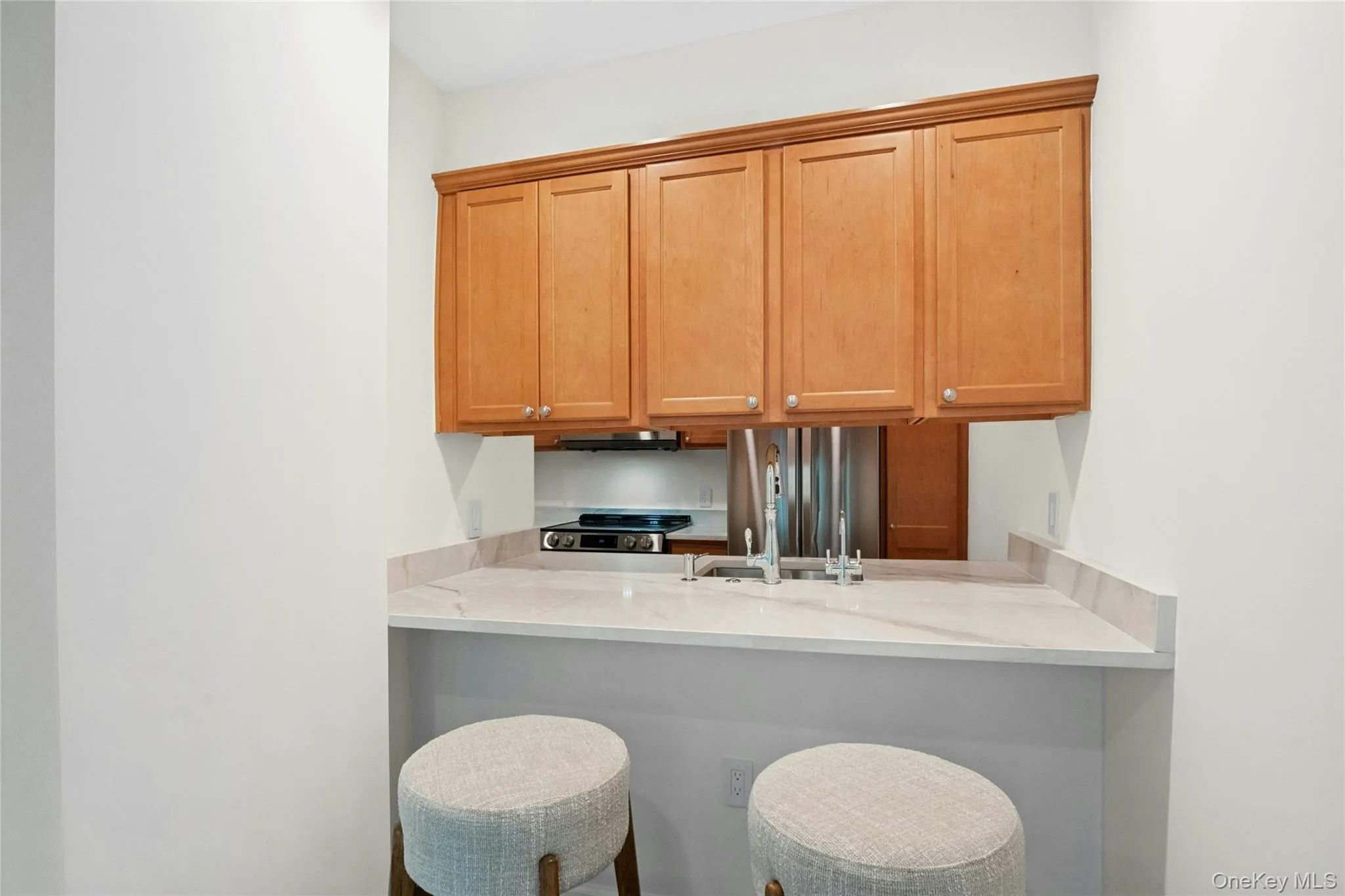 Breakfast bar with seating area open to kitchen Breakfast bar with seating area open to kitchen