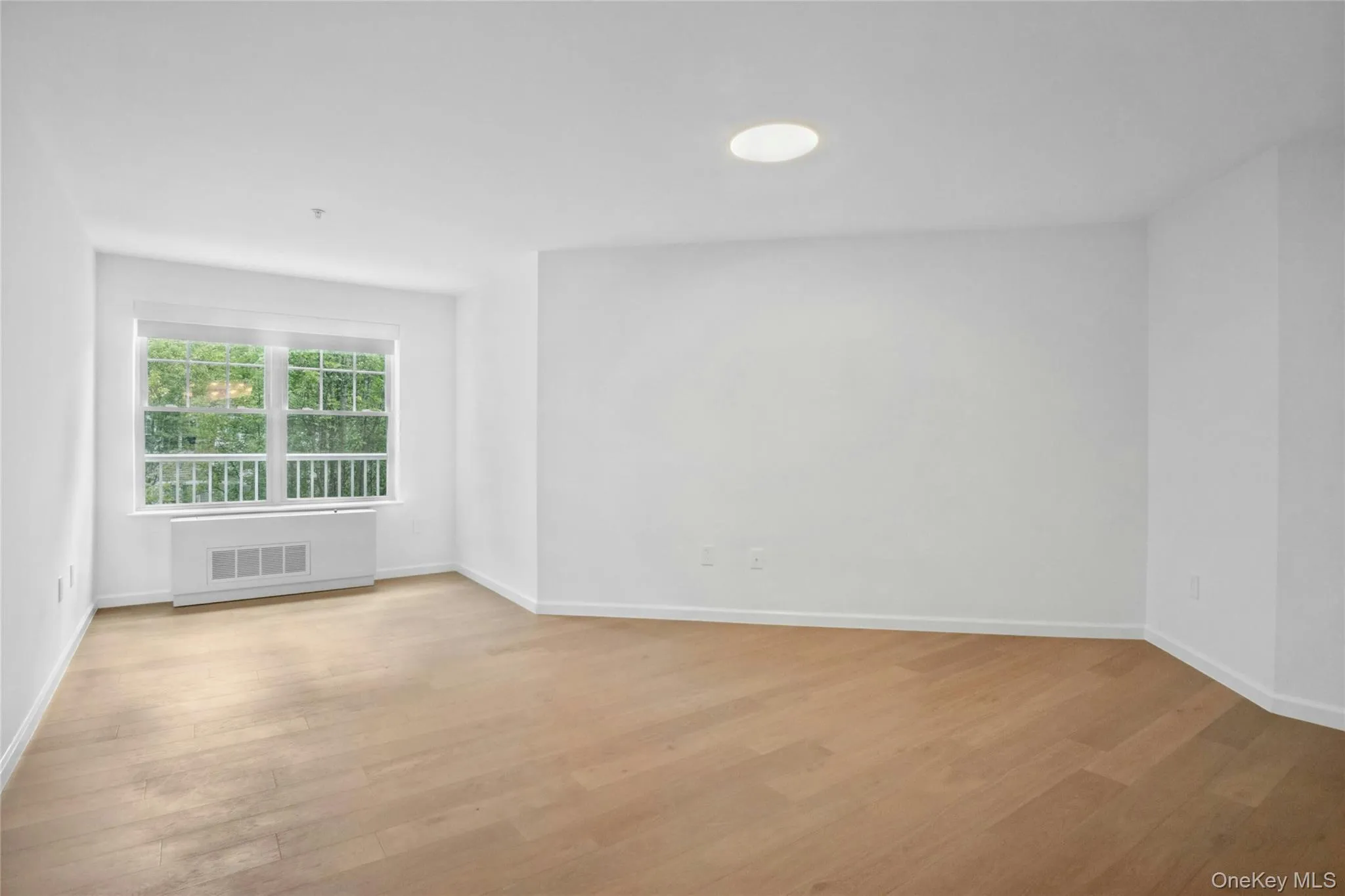 King sized primary bedroom with updated lighting and cozy windowed reading nook with remote controlled motorized shades King sized primary bedroom with updated lighting and cozy windowed reading nook with remote controlled motorized shades