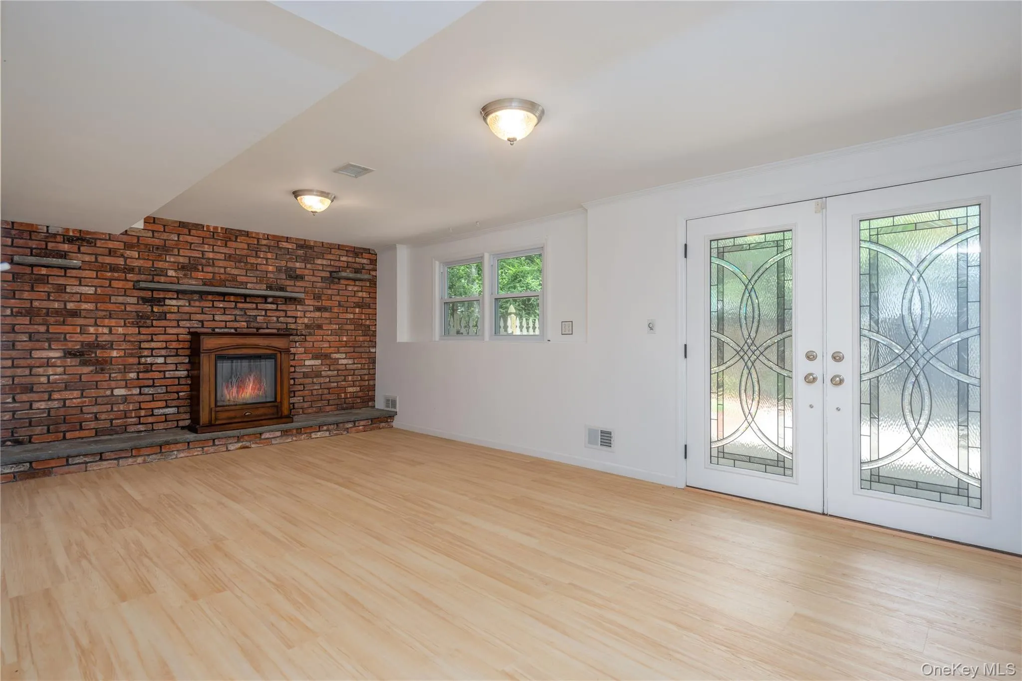 Brick fireplace and beautiful french doors Brick fireplace and beautiful french doors