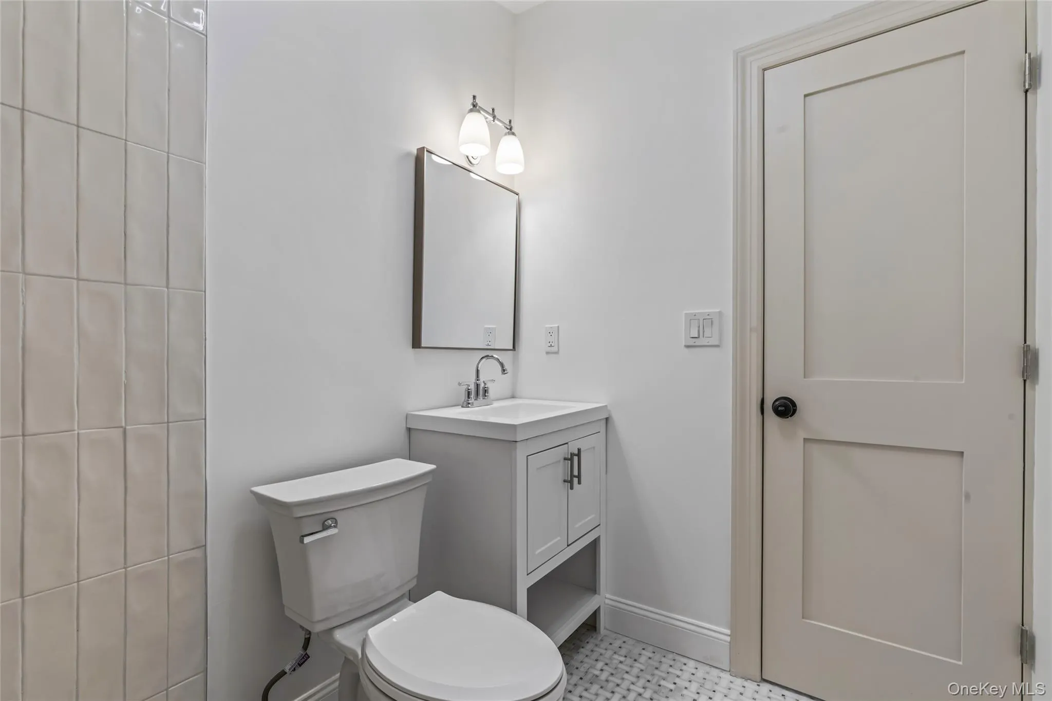 Bathroom featuring vanity and toilet Bathroom featuring vanity and toilet