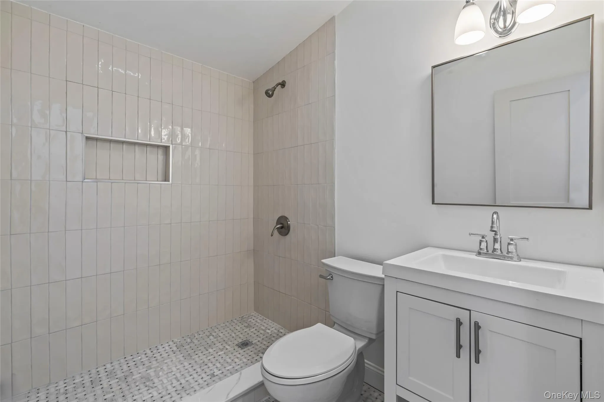 Full bath with vanity and tiled shower Full bath with vanity and tiled shower