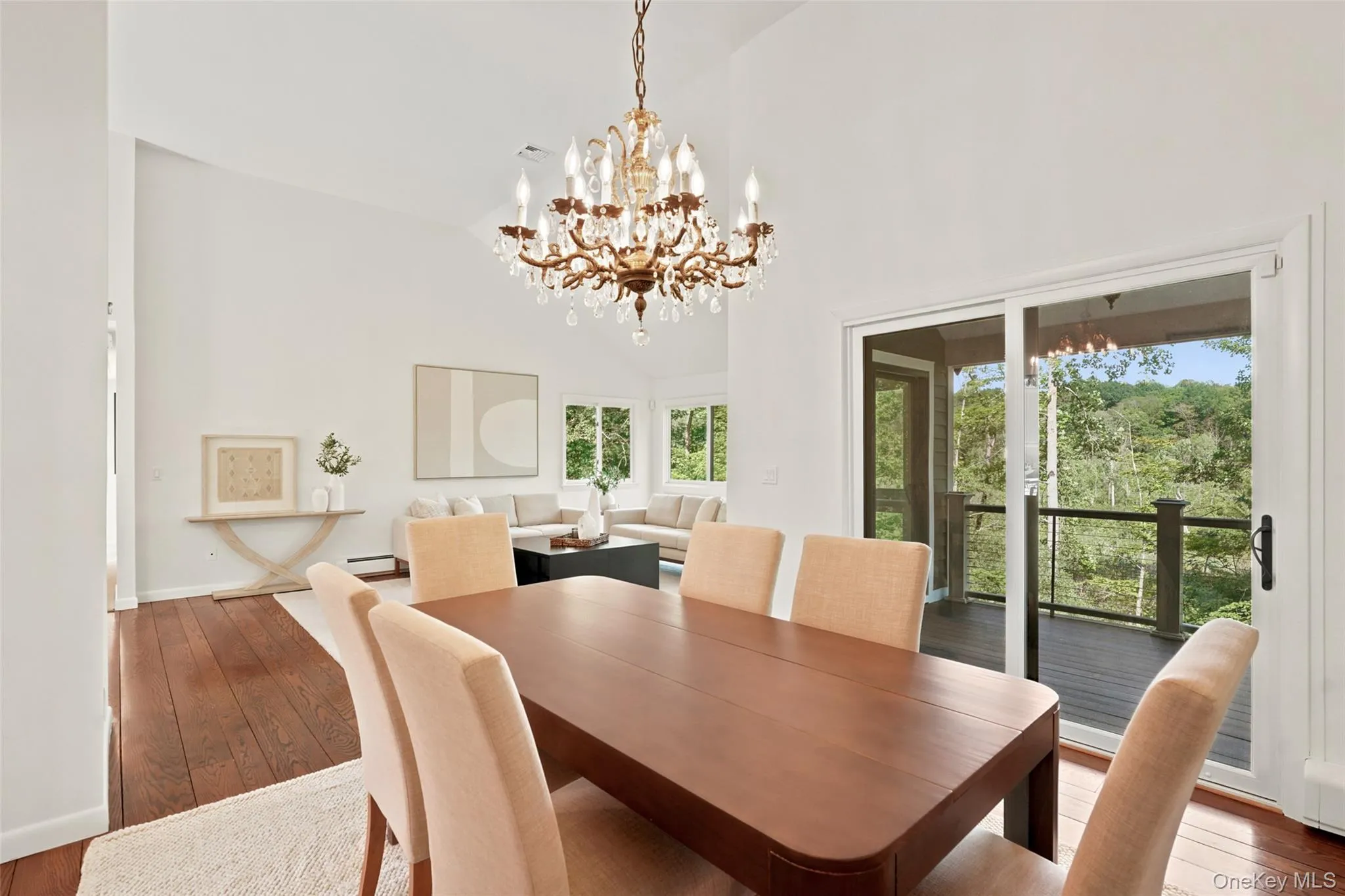 Dining room overlooks the beautiful property, with sliding glass doors to new deck Dining room overlooks the beautiful property, with sliding glass doors to new deck