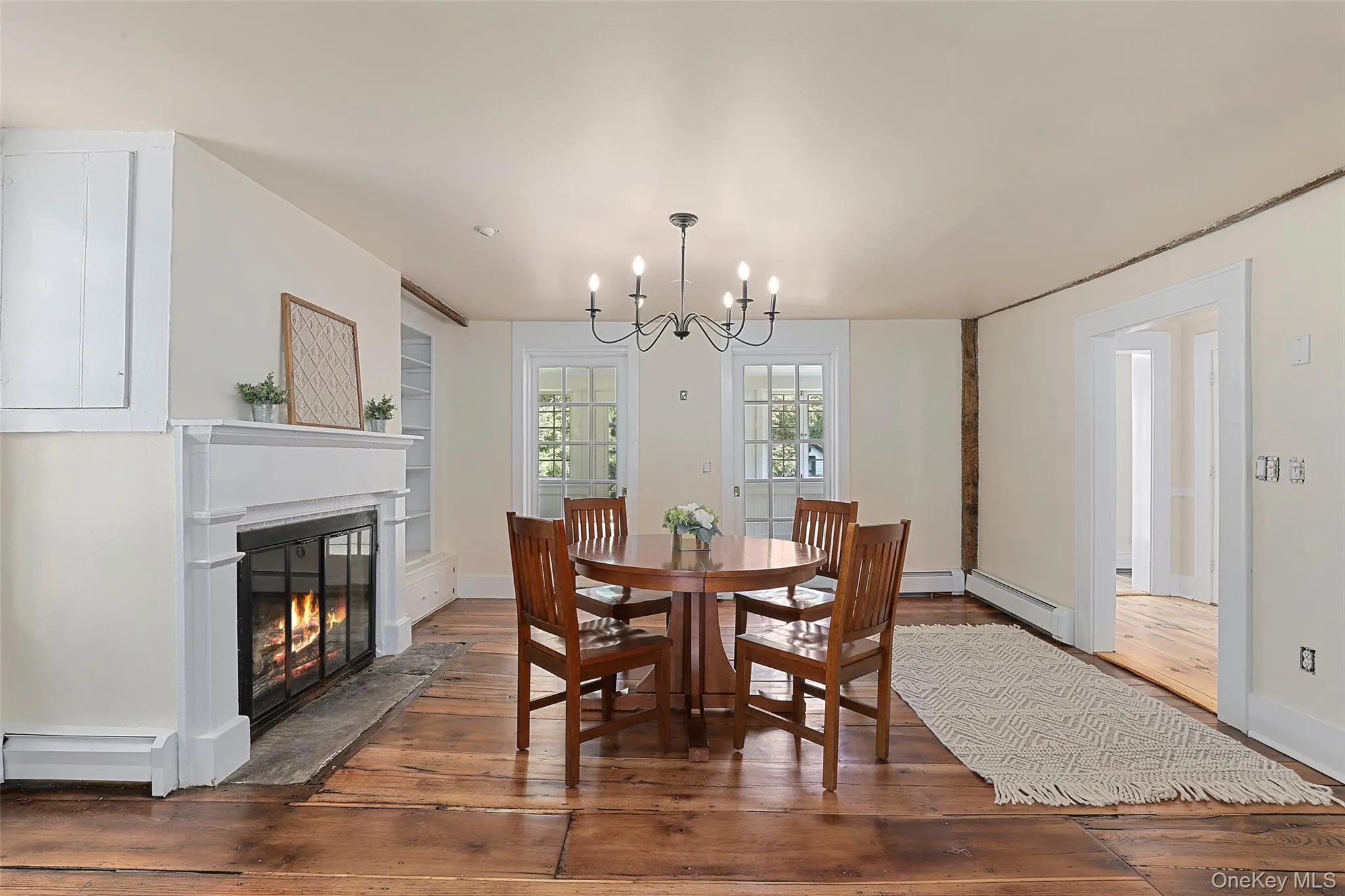 Wood burning fireplace, wide plank wood floors Wood burning fireplace, wide plank wood floors