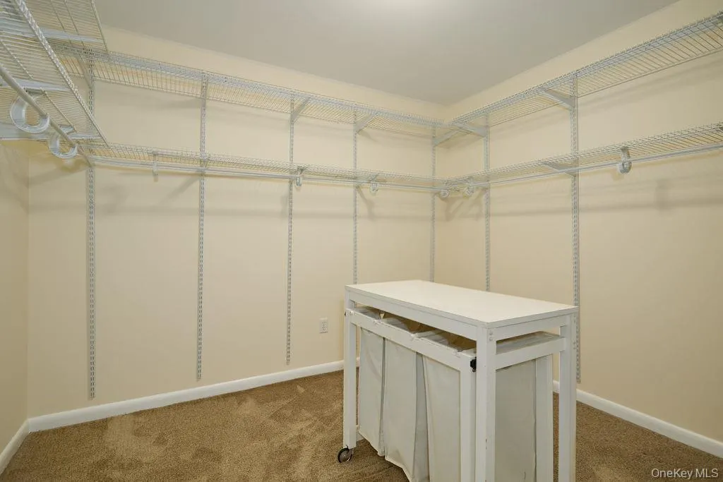 Primary bedroom walk in closet Primary bedroom walk in closet