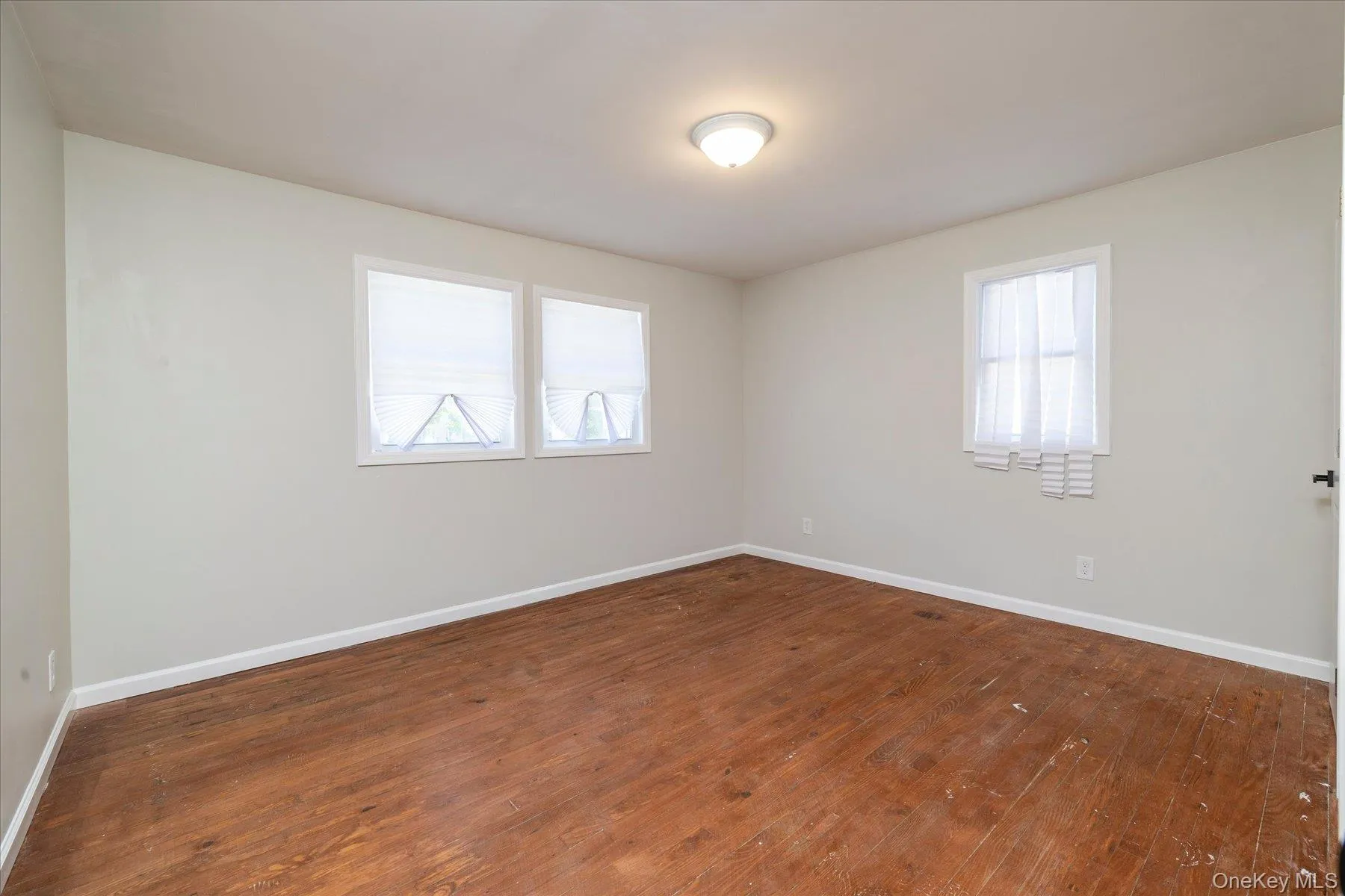 Neutral wall paint complements wood-finish flooring Neutral wall paint complements wood-finish flooring