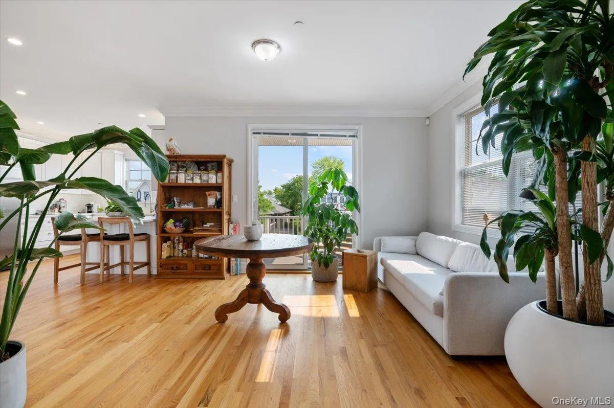 Sitting room with healthy amount of natural light, ornamental molding, wood finished floors, and recessed lighting Sitting room with healthy amount of natural light, ornamental molding, wood finished floors, and recessed lighting