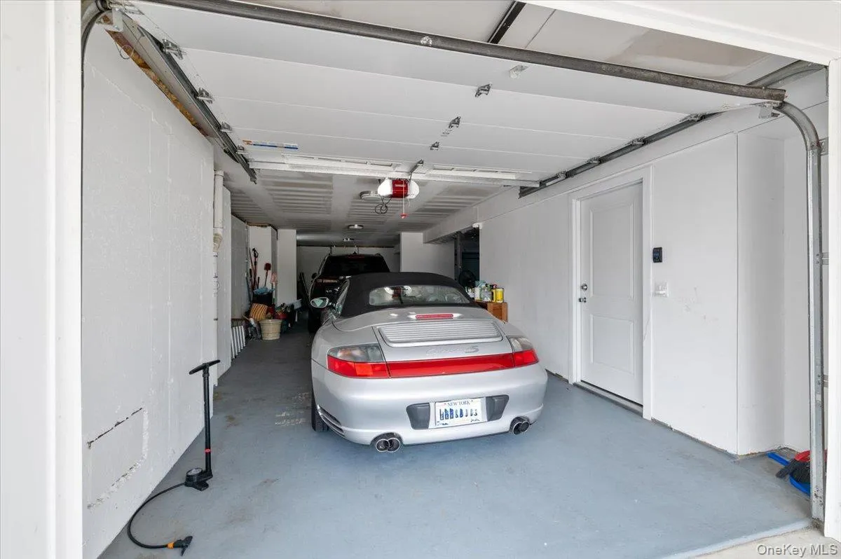 Garage featuring a garage door opener Garage featuring a garage door opener