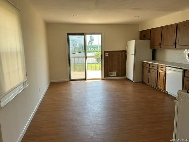 Spacious kitchen allows for ample dining space. Kitchen has slider to rear deck Spacious kitchen allows for ample dining space. Kitchen has slider to rear deck
