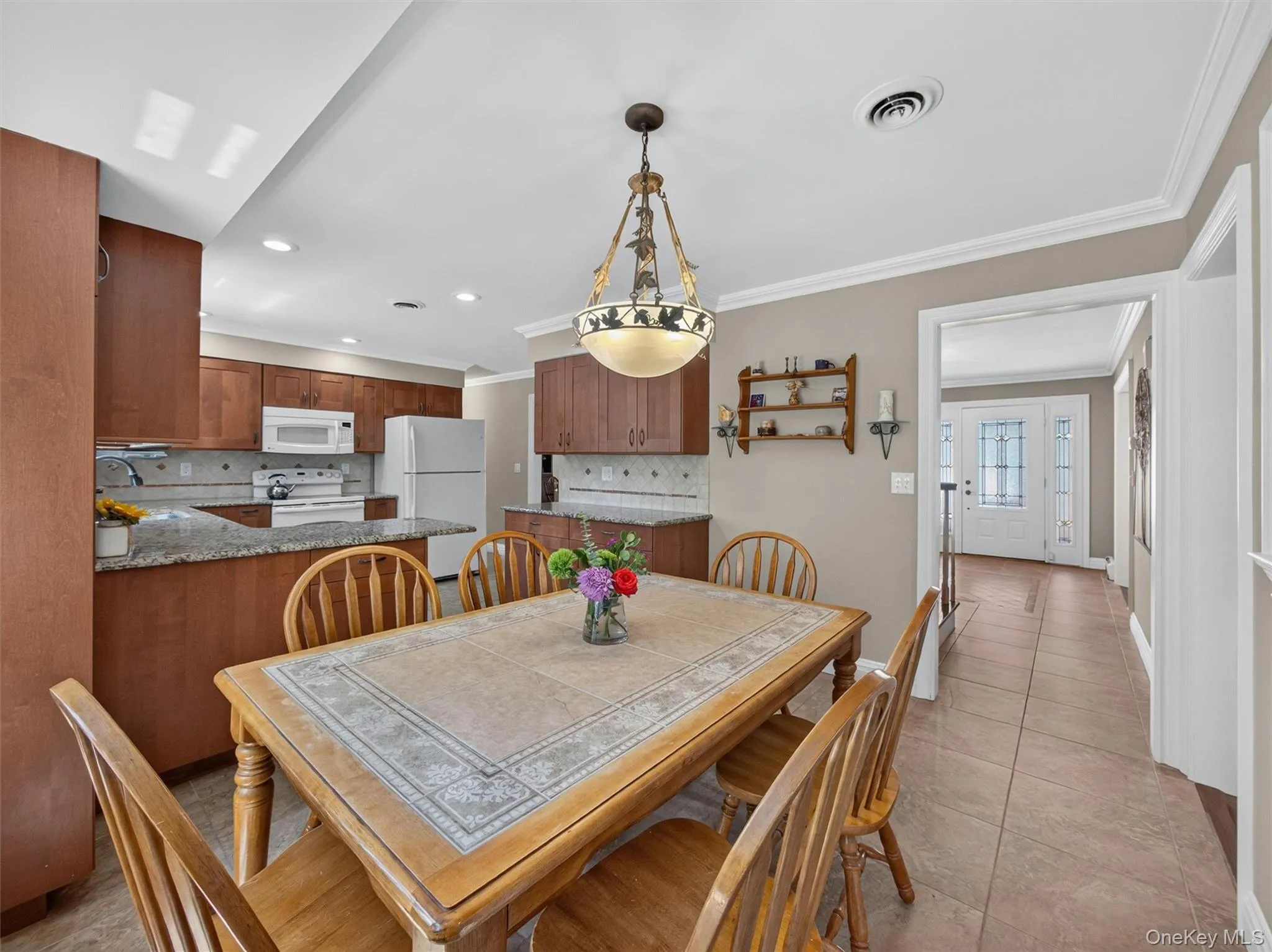 Spacious and welcoming, the eat-in area offers room to gather while remaining connected to the surrounding living spaces. Spacious and welcoming, the eat-in area offers room to gather while remaining connected to the surrounding living spaces.