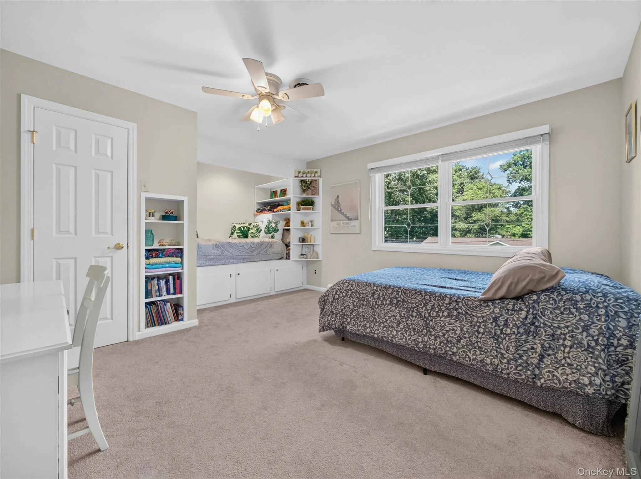 Spacious, bright, and thoughtfully designed, this oversized bedroom features custom built-ins, a walk-in closet, and room to grow. Spacious, bright, and thoughtfully designed, this oversized bedroom features custom built-ins, a walk-in closet, and room to grow.