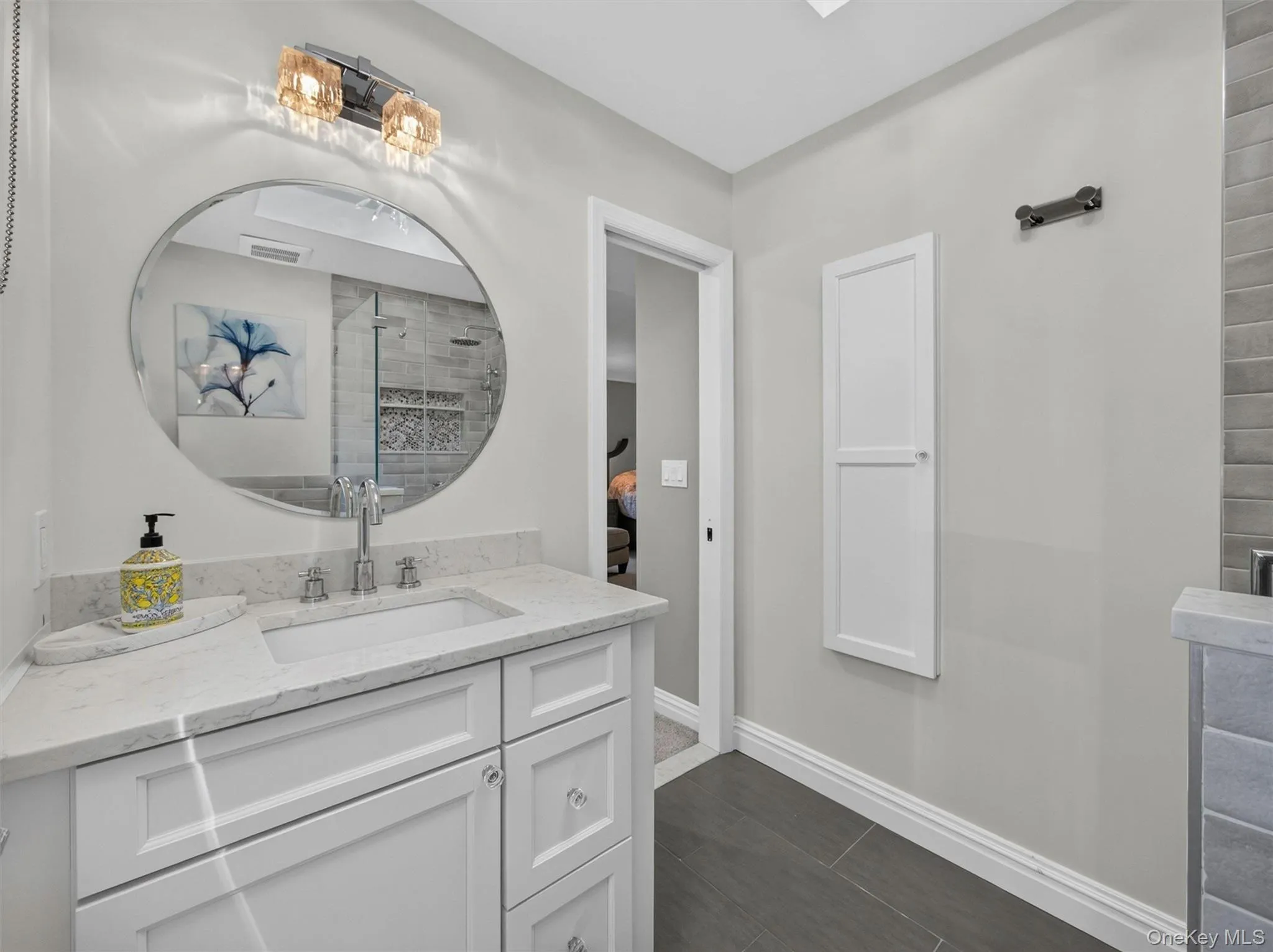 Clean lines and well-placed storage enhance the functionality of this well-appointed bath. Clean lines and well-placed storage enhance the functionality of this well-appointed bath.