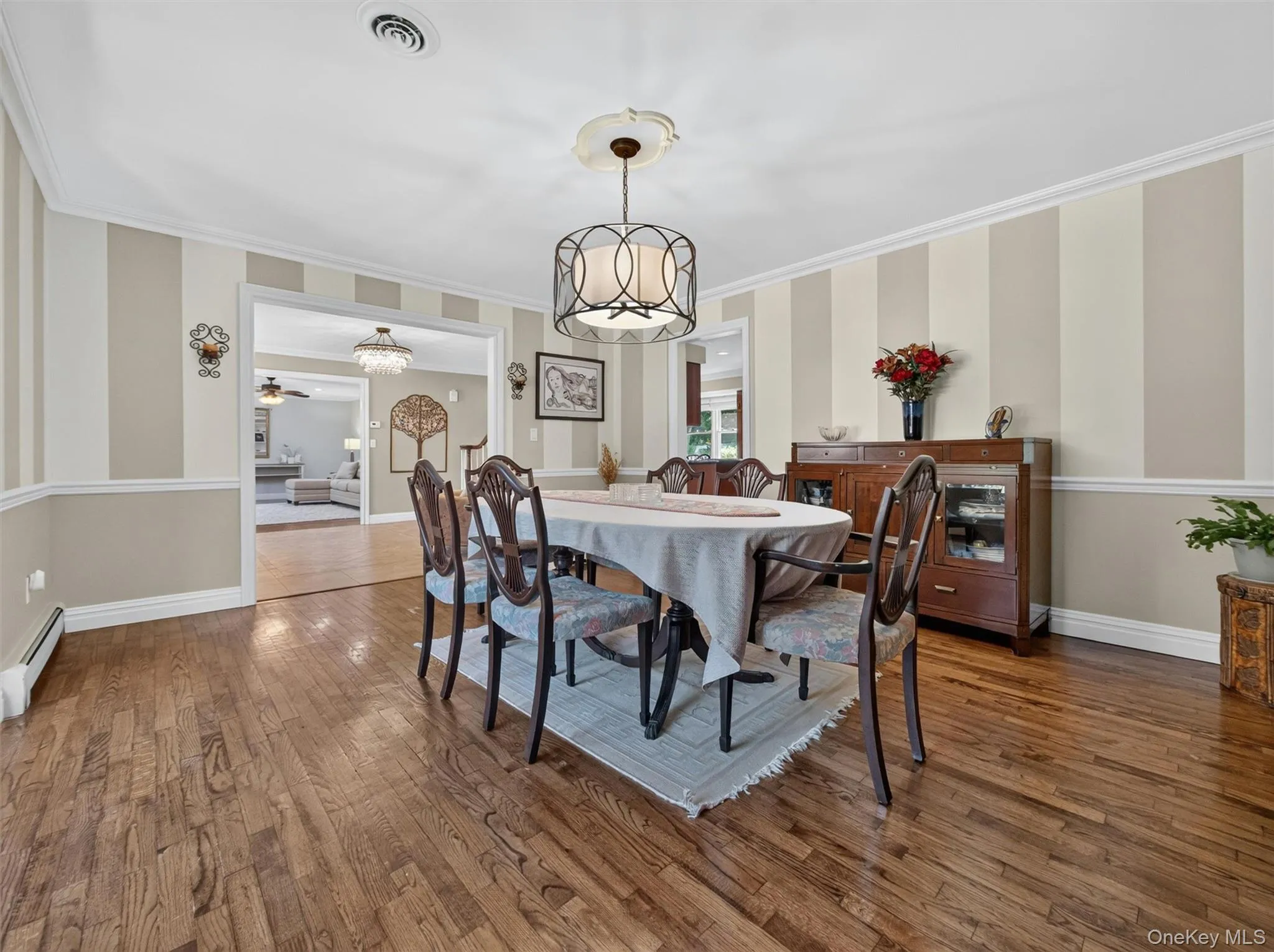 Conveniently situated adjacent to the kitchen, the dining room balances elegance and functionality for effortless entertaining. Conveniently situated adjacent to the kitchen, the dining room balances elegance and functionality for effortless entertaining.