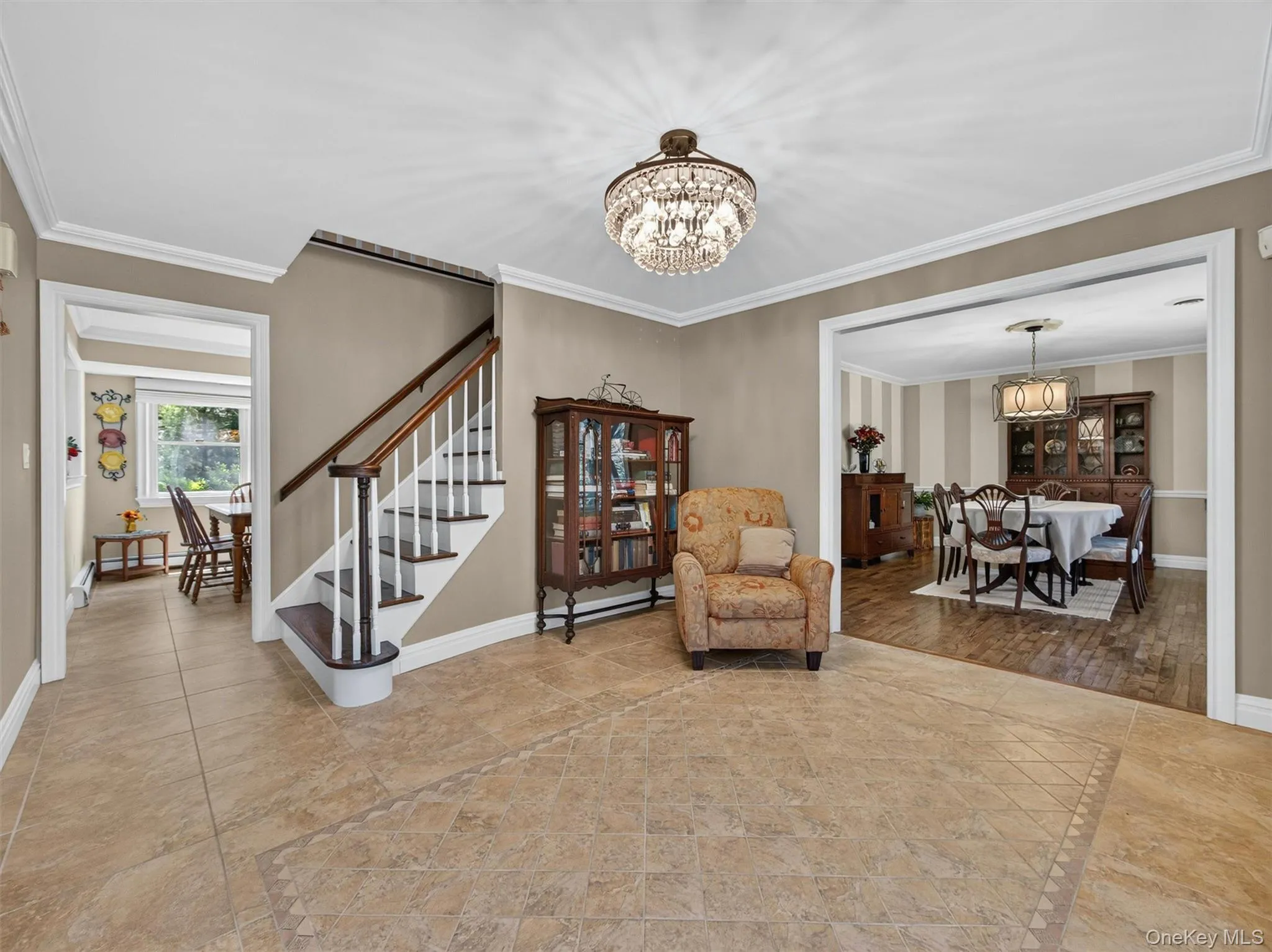 The spacious foyer creates an inviting first impression, highlighted by classic architectural details and abundant natural light. The spacious foyer creates an inviting first impression, highlighted by classic architectural details and abundant natural light.