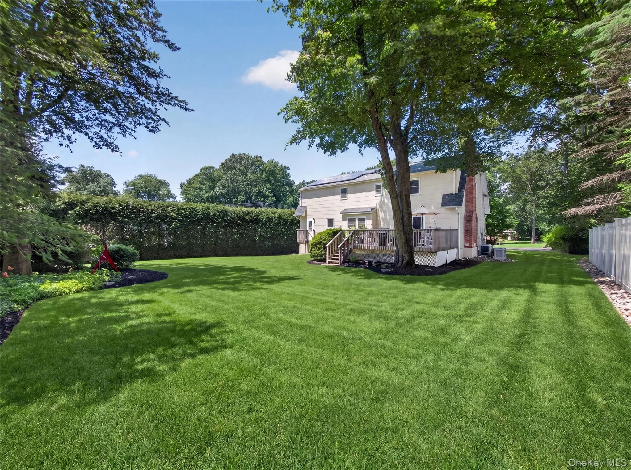 A sprawling, level backyard provides exceptional space for recreation, gardening, outdoor activities, or simply enjoying the beauty of the outdoors. A sprawling, level backyard provides exceptional space for recreation, gardening, outdoor activities, or simply enjoying the beauty of the outdoors.