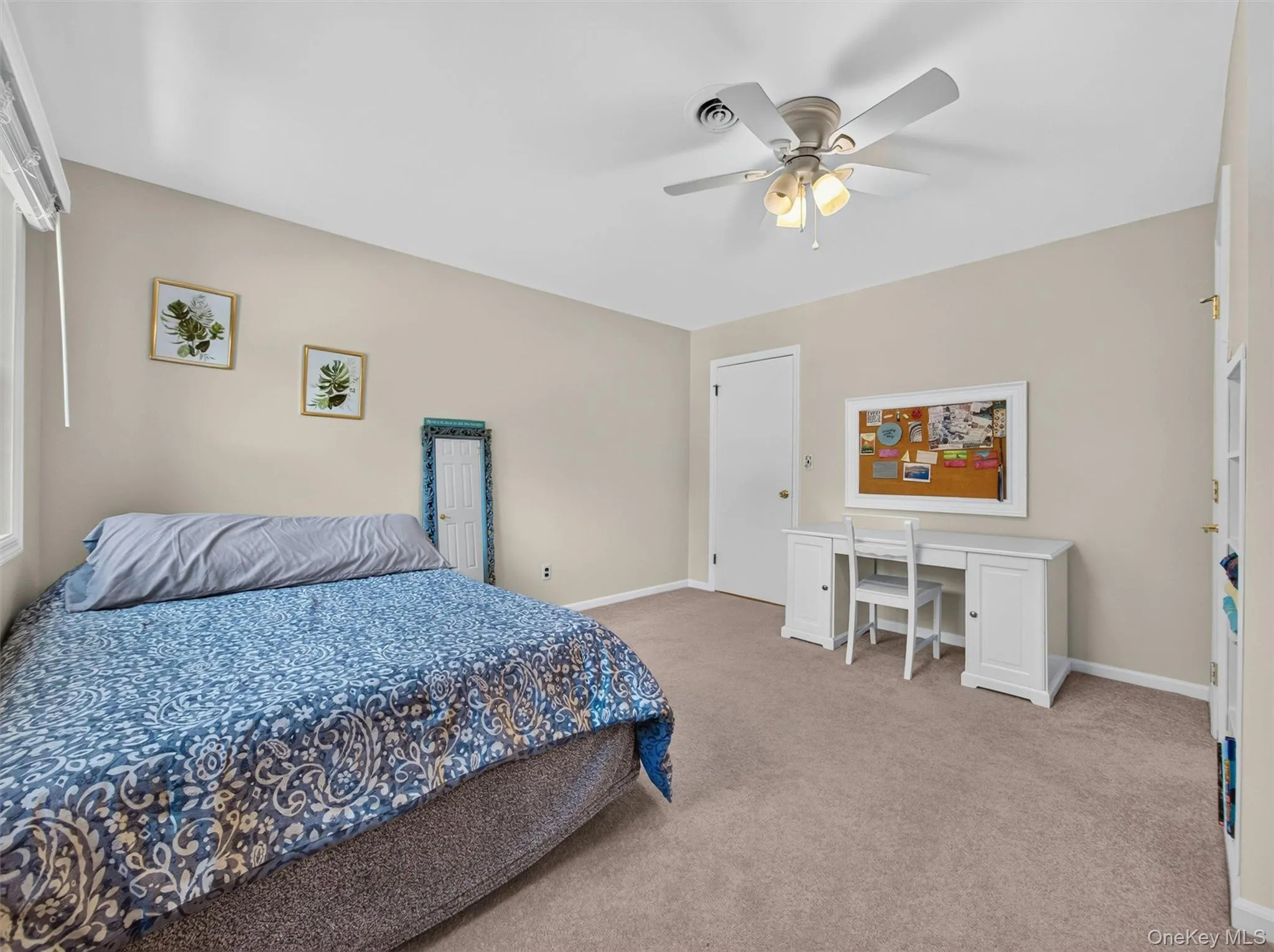 Larger than many primary bedrooms in today's new construction, this oversized secondary bedroom features built-in storage and exceptional space. Larger than many primary bedrooms in today's new construction, this oversized secondary bedroom features built-in storage and exceptional space.