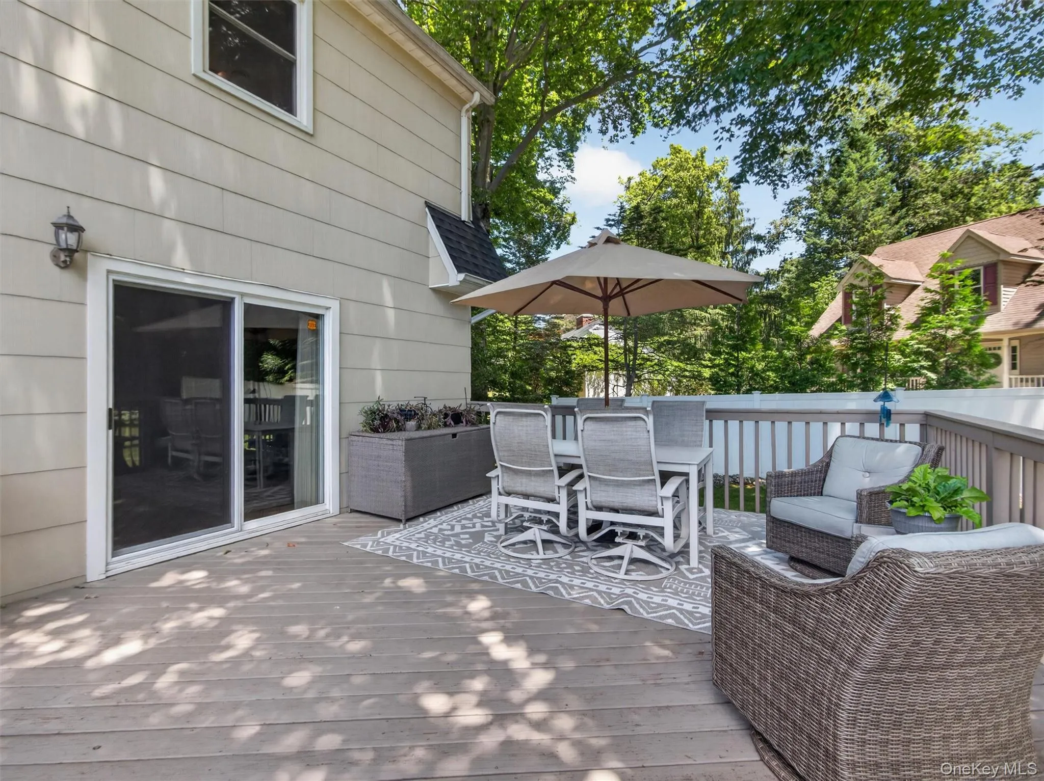 Easily accessible from the family room, the deck creates a seamless connection between indoor and outdoor living. Easily accessible from the family room, the deck creates a seamless connection between indoor and outdoor living.