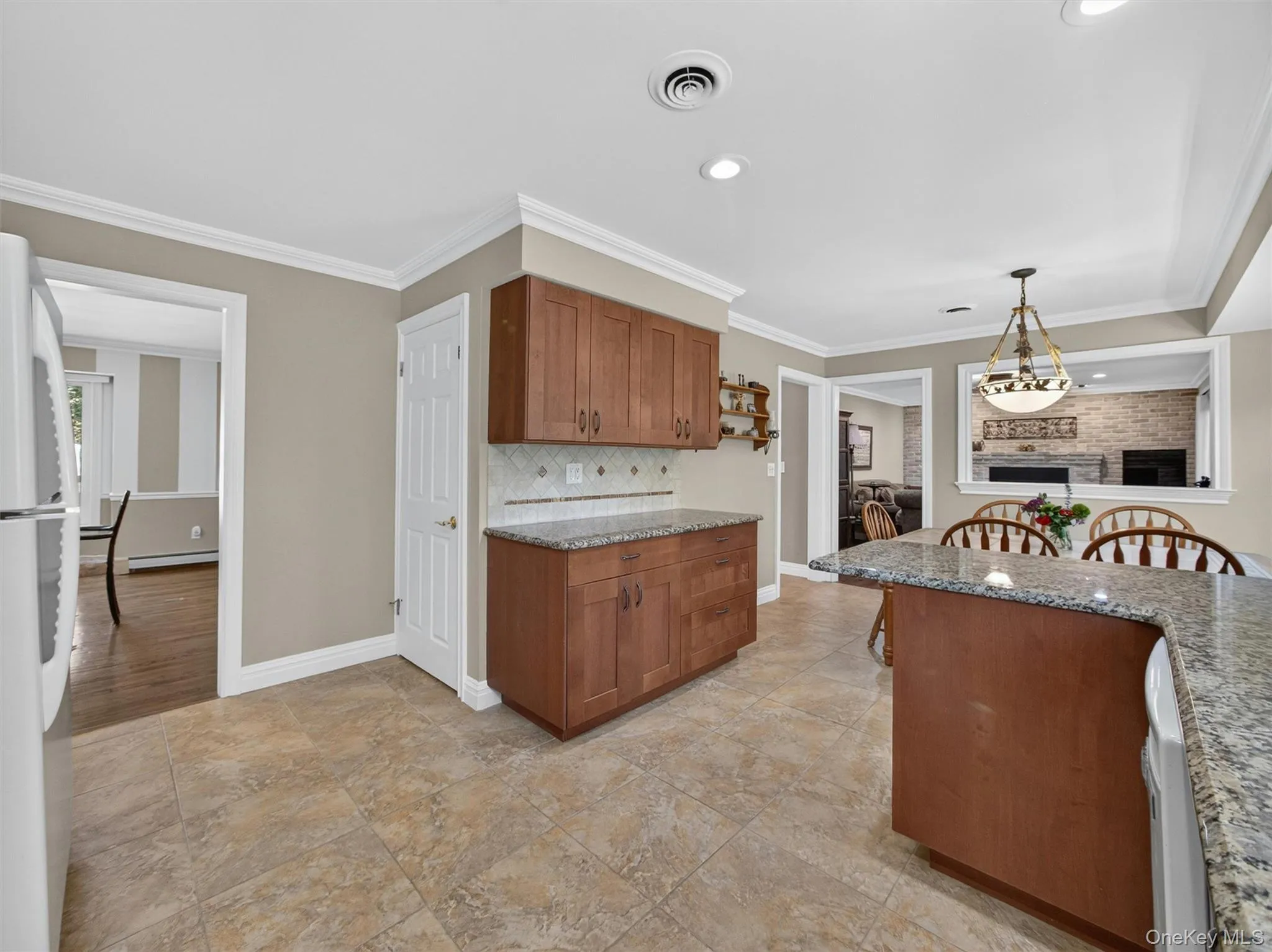 Workspace and storage make this kitchen as practical as it is welcoming. Workspace and storage make this kitchen as practical as it is welcoming.