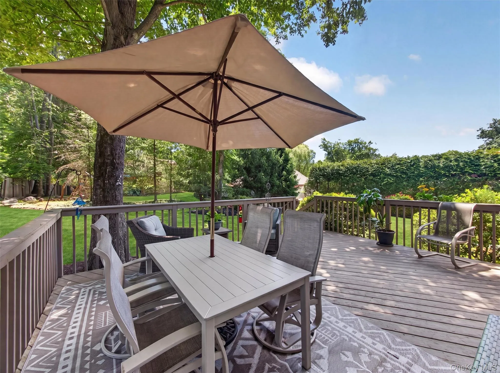 With room to gather, relax, and unwind, the deck extends the home's living space into the outdoors. With room to gather, relax, and unwind, the deck extends the home's living space into the outdoors.