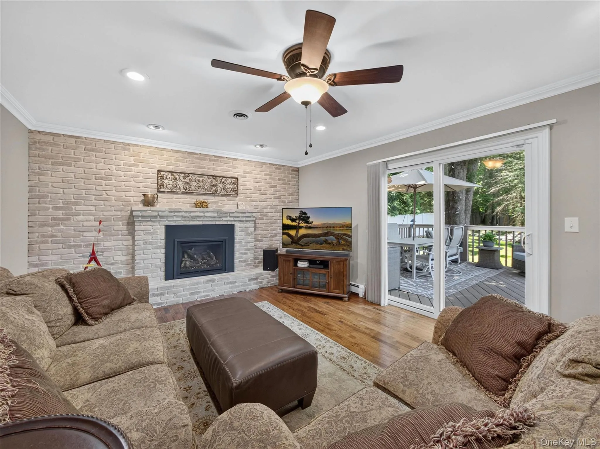 Designed for comfort and connection, the family room combines generous living space, a striking fireplace, and views of the backyard beyond. Designed for comfort and connection, the family room combines generous living space, a striking fireplace, and views of the backyard beyond.
