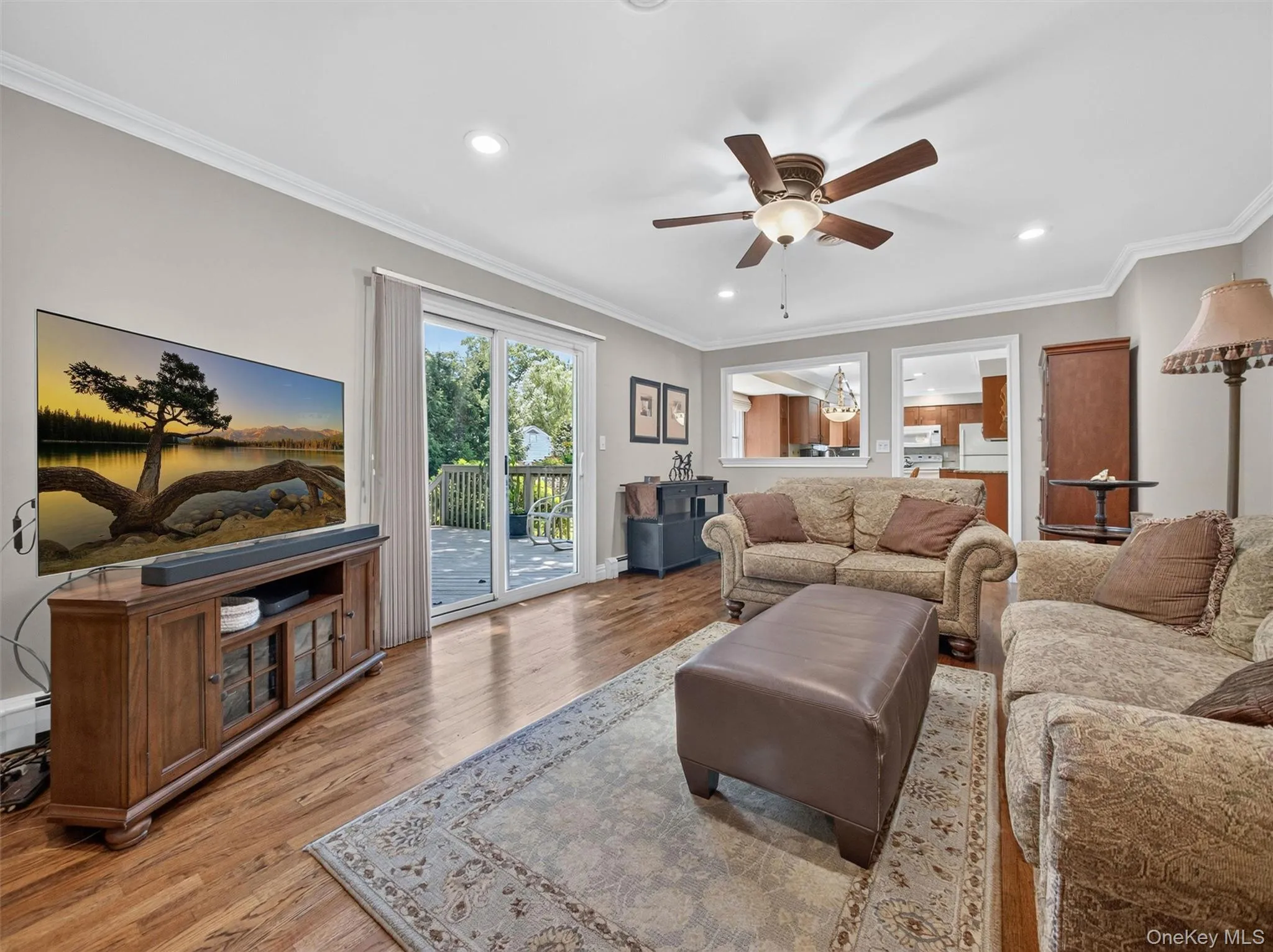 Sliding glass doors provide easy access to the outdoor living area while keeping the room bright and connected to the backyard. Sliding glass doors provide easy access to the outdoor living area while keeping the room bright and connected to the backyard.