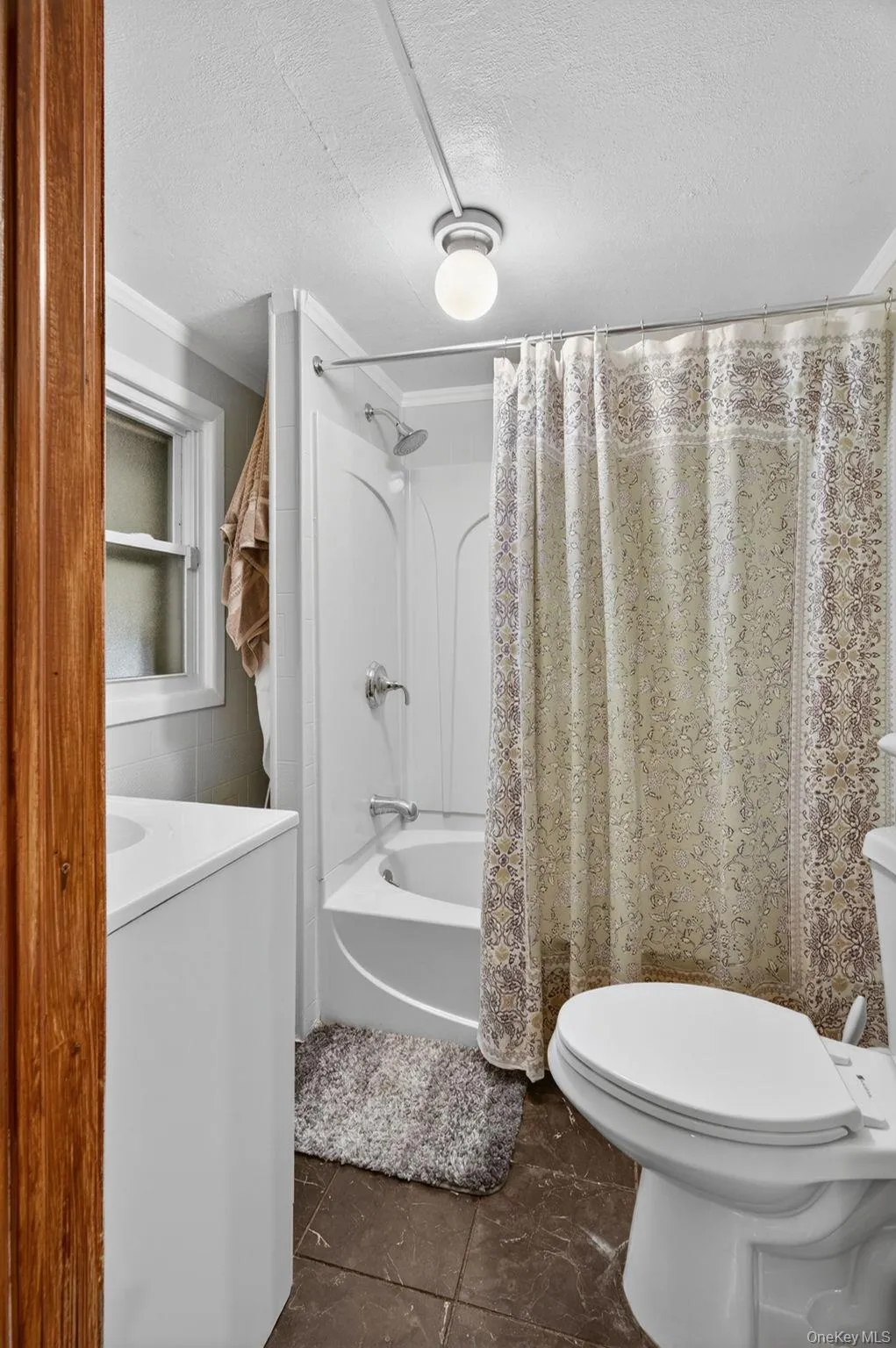 The first-floor bathroom is thoughtfully designed for both comfort and convenience, featuring a full tub and shower combination that is perfect for daily routines. The first-floor bathroom is thoughtfully designed for both comfort and convenience, featuring a full tub and shower combination that is perfect for daily routines.