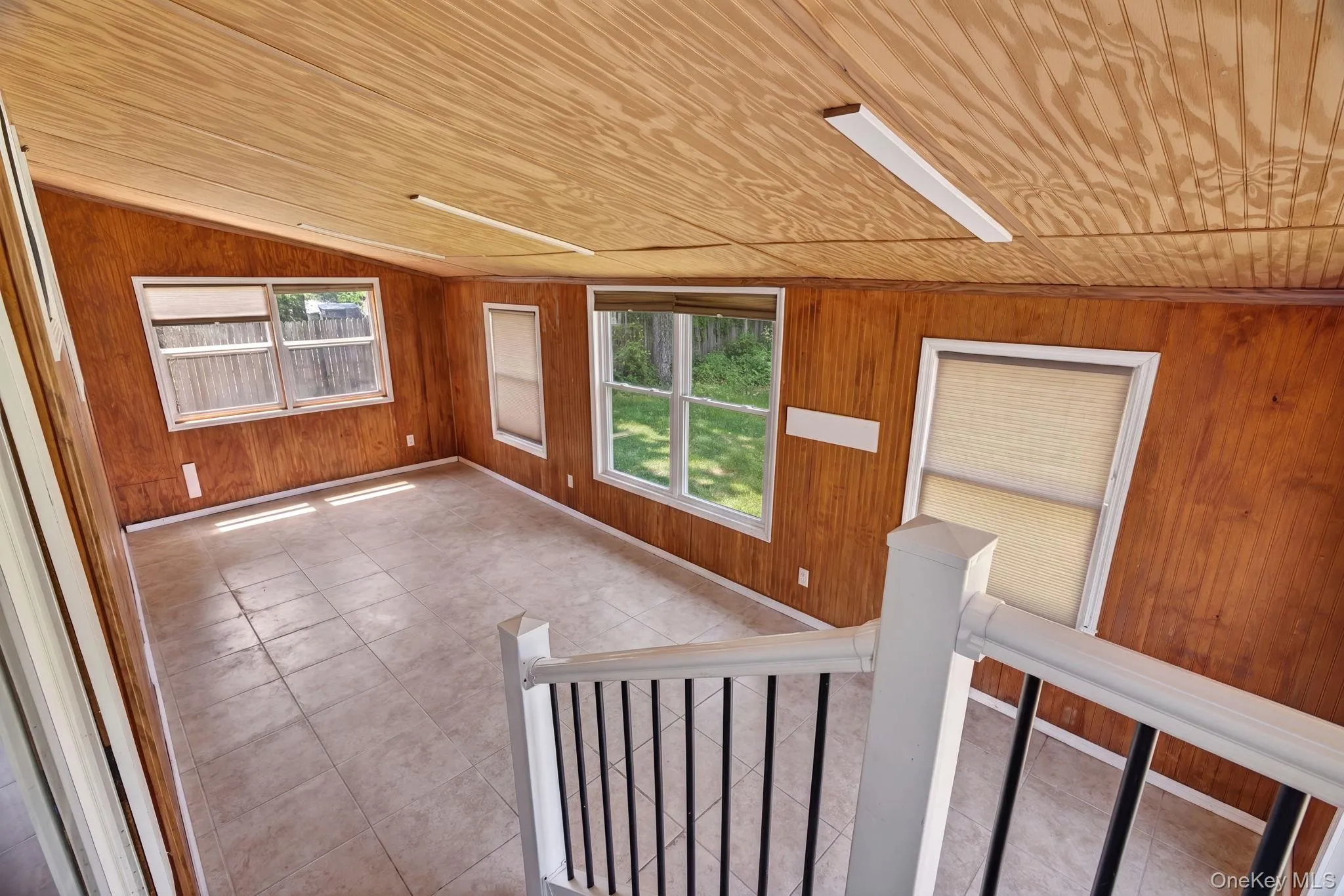 Step into the expansive enclosed patio, a bright and inviting retreat designed for year-round enjoyment. Surrounded by walls of windows, this sun-filled space is bathed in natural light, creating a warm and airy atmosphere while offering beautiful views of the surrounding yard. Step into the expansive enclosed patio, a bright and inviting retreat designed for year-round enjoyment. Surrounded by walls of windows, this sun-filled space is bathed in natural light, creating a warm and airy atmosphere while offering beautiful views of the surrounding yard.