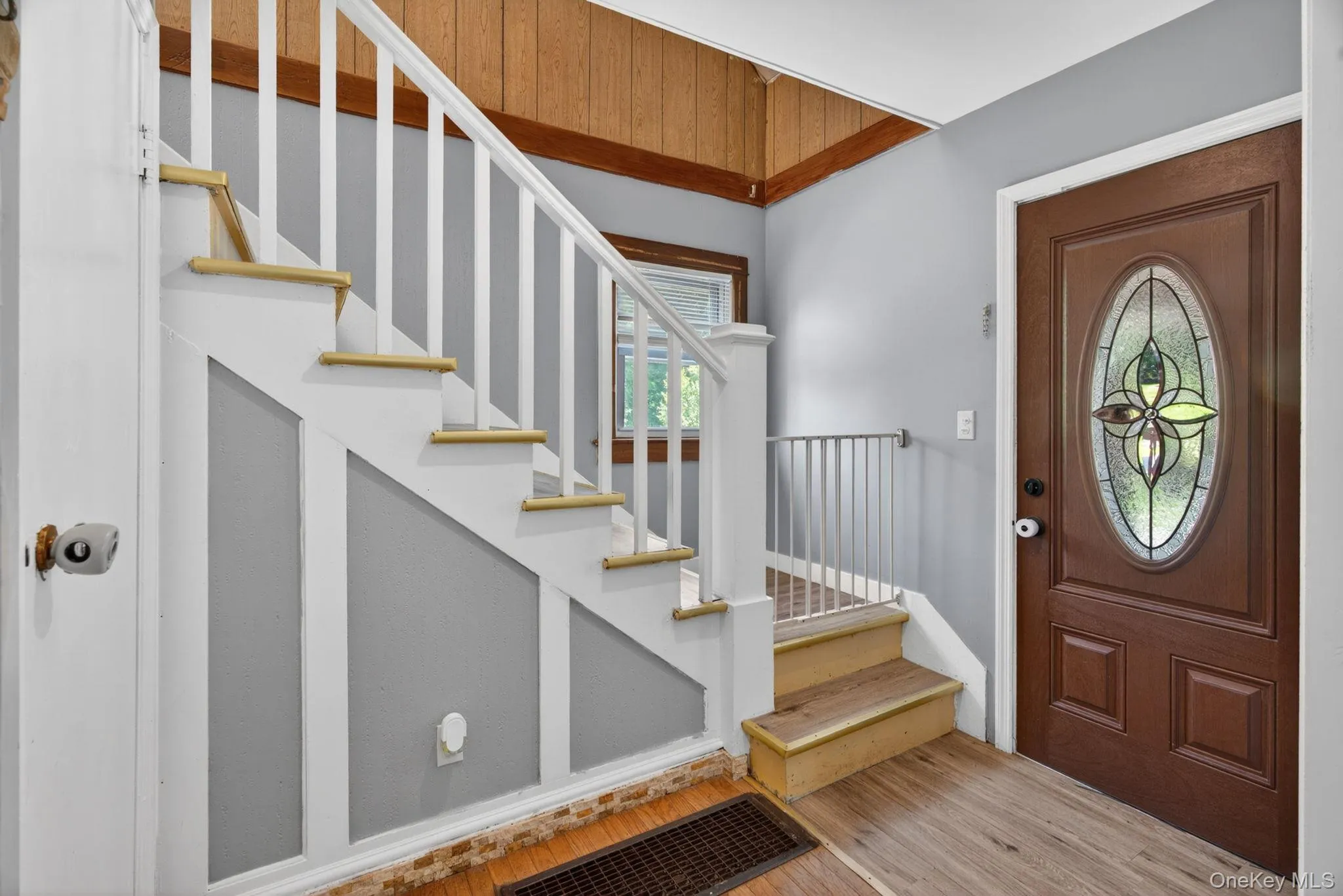 The staircase, gracefully ascending to the second level, serves as an attractive focal point, creating an inviting flow throughout the home while enhancing the classic charm of the interior. The staircase, gracefully ascending to the second level, serves as an attractive focal point, creating an inviting flow throughout the home while enhancing the classic charm of the interior.