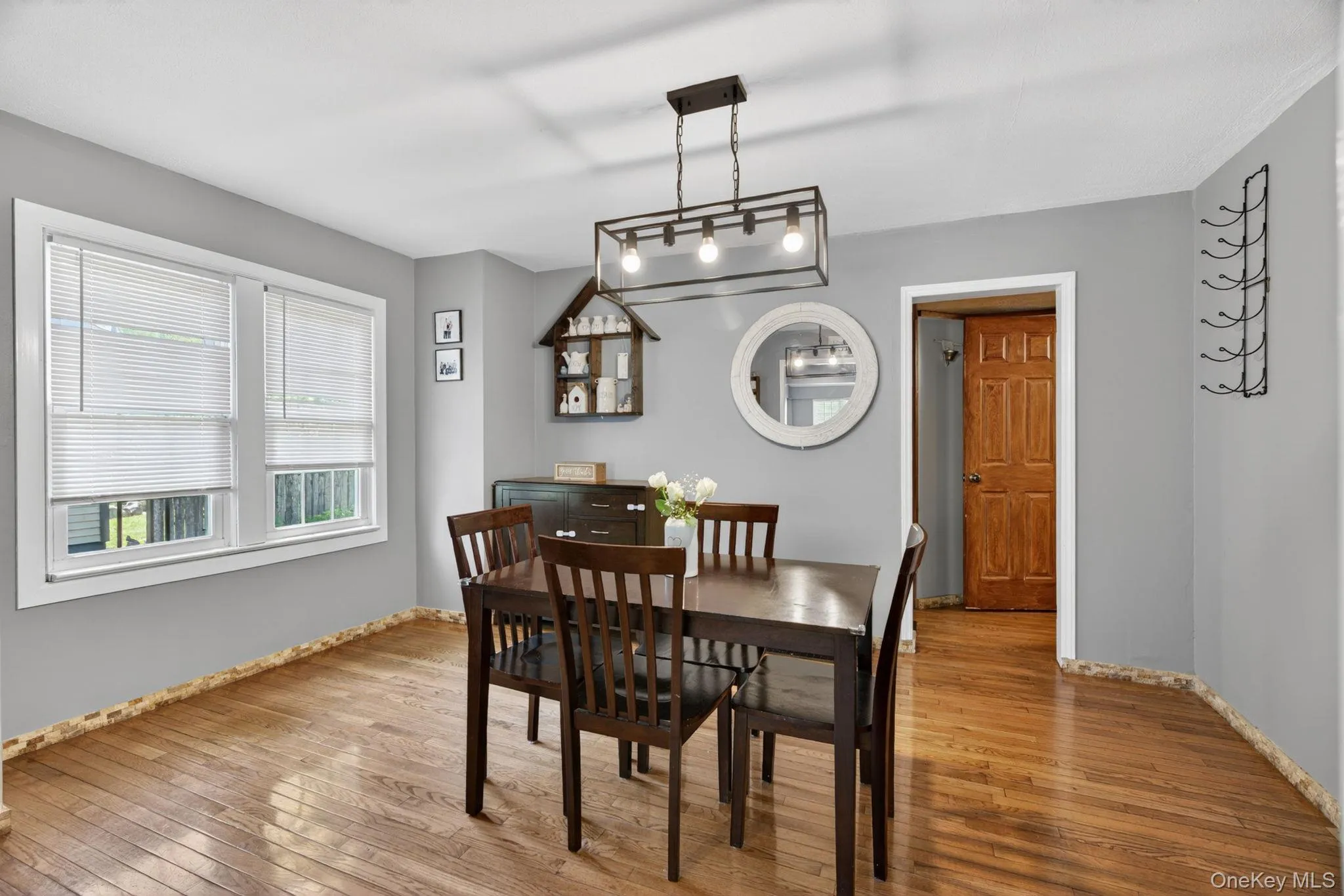 The dining room offers a warm and inviting space for both everyday meals and special gatherings. Beautiful hardwood floors add timeless elegance and character, while the generous layout provides plenty of room for a large dining table and additional furnishings. The dining room offers a warm and inviting space for both everyday meals and special gatherings. Beautiful hardwood floors add timeless elegance and character, while the generous layout provides plenty of room for a large dining table and additional furnishings.