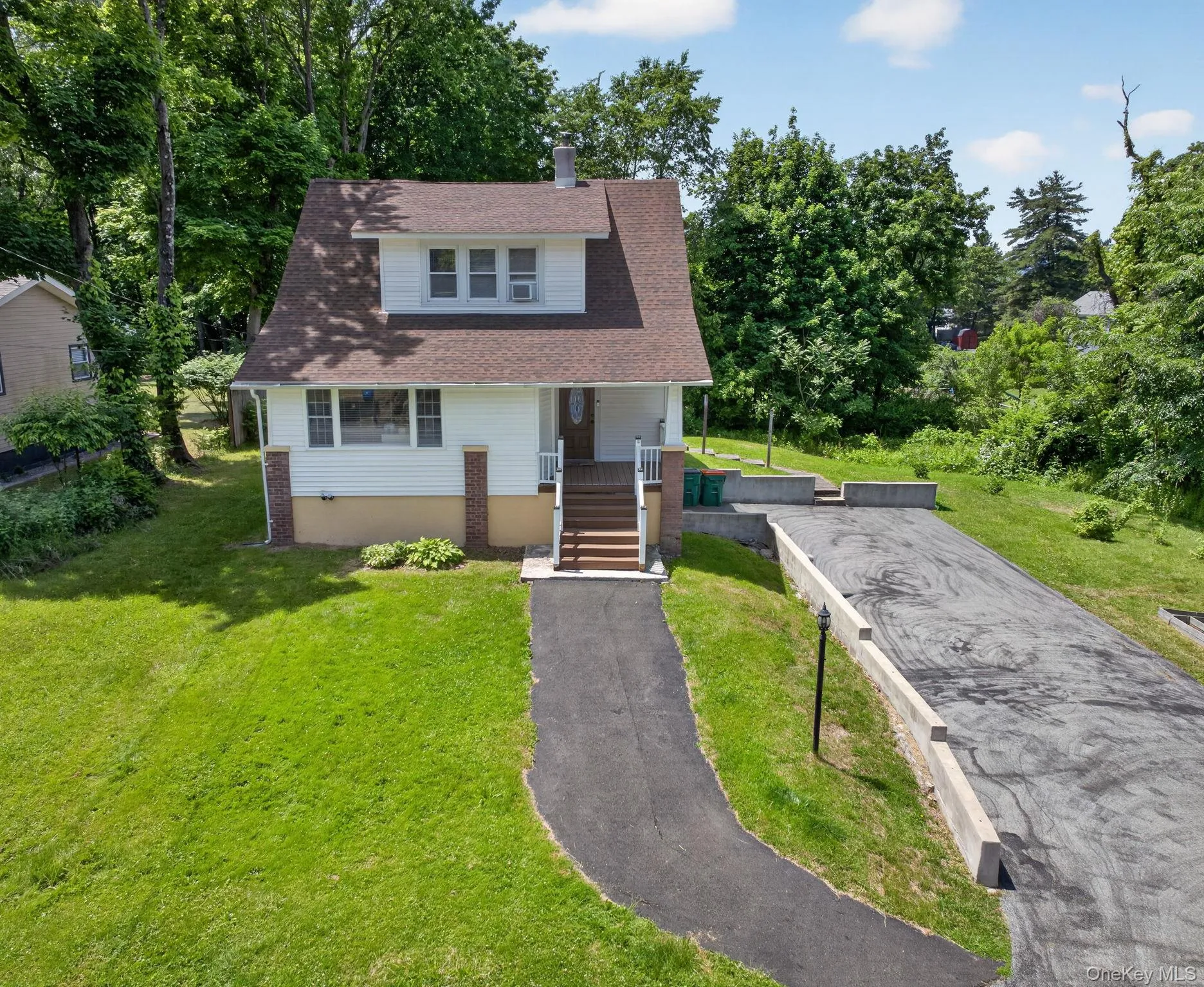 Its classic design features a welcoming front porch, dormer windows, and a warm, inviting exterior that instantly feels like home. Its classic design features a welcoming front porch, dormer windows, and a warm, inviting exterior that instantly feels like home.