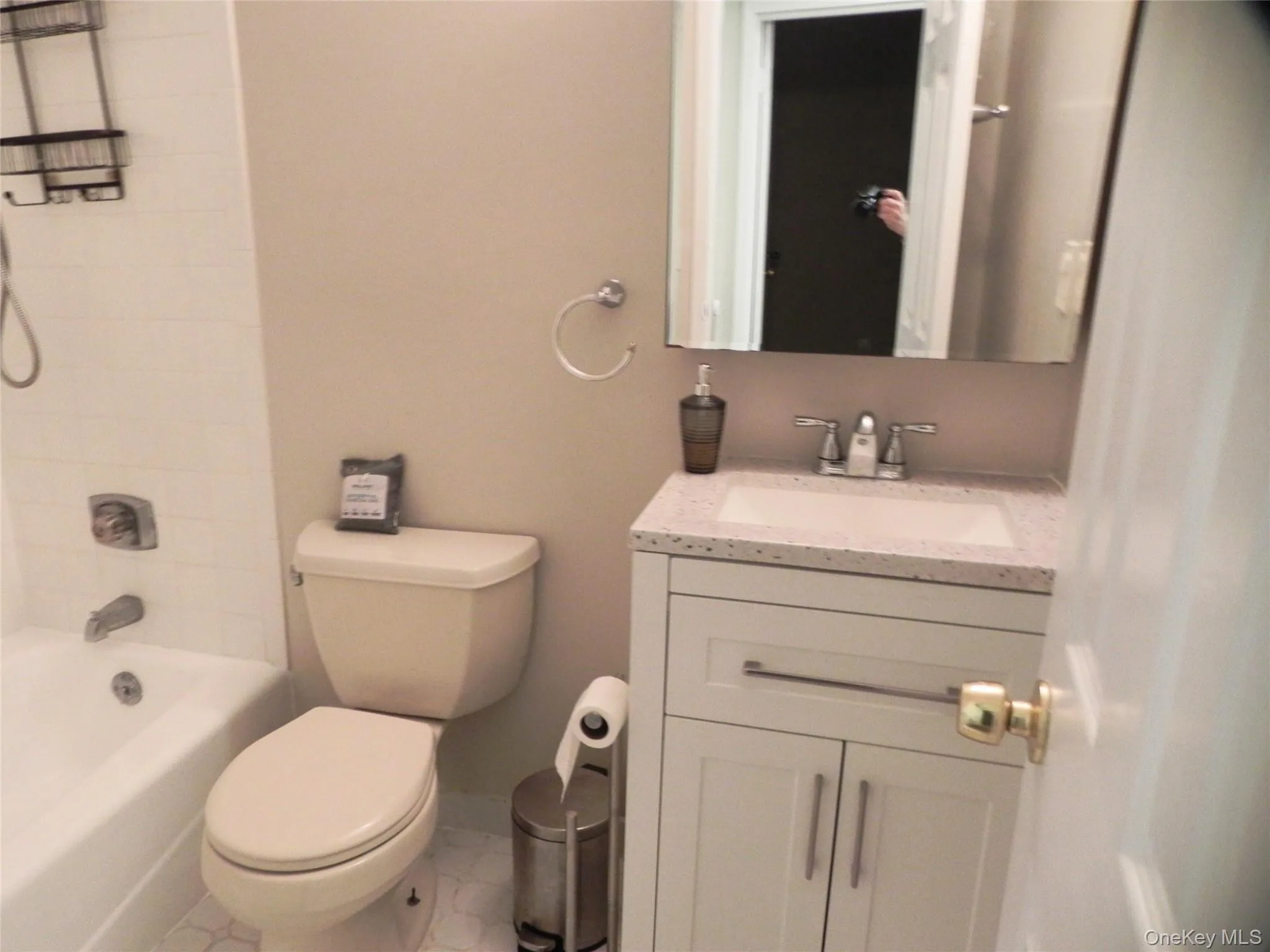Full bathroom with vanity, shower / bath combination, and tile patterned flooring Full bathroom with vanity, shower / bath combination, and tile patterned flooring