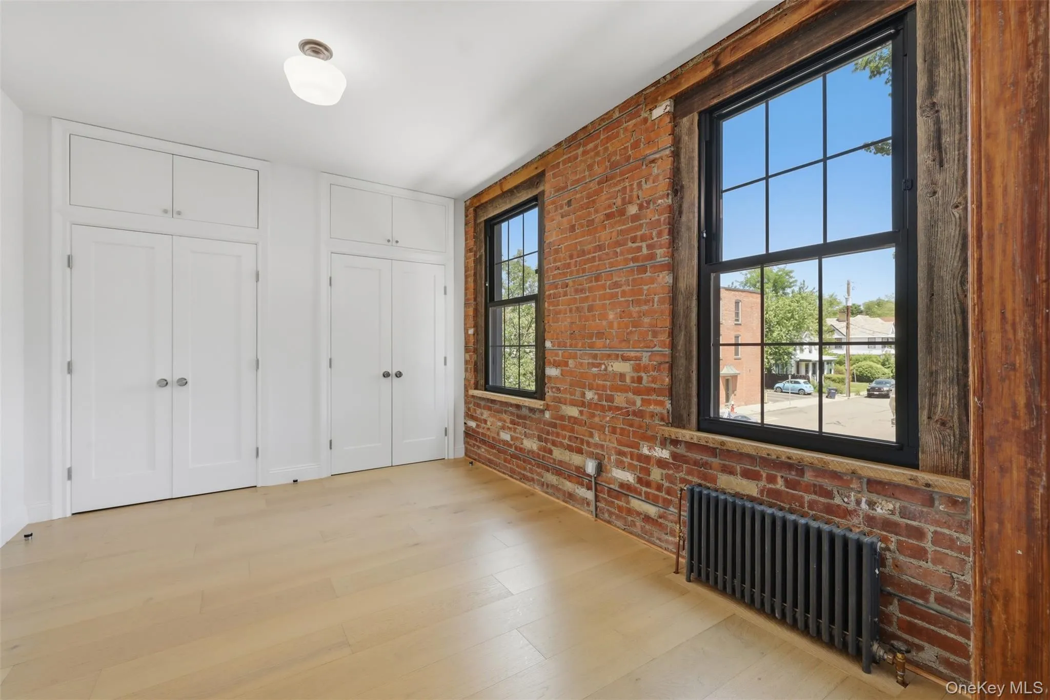 Enter your Spacious Bedroom through Original Pocket Door and enjoy Large Windows, Double Closets + Additional storage Enter your Spacious Bedroom through Original Pocket Door and enjoy Large Windows, Double Closets + Additional storage