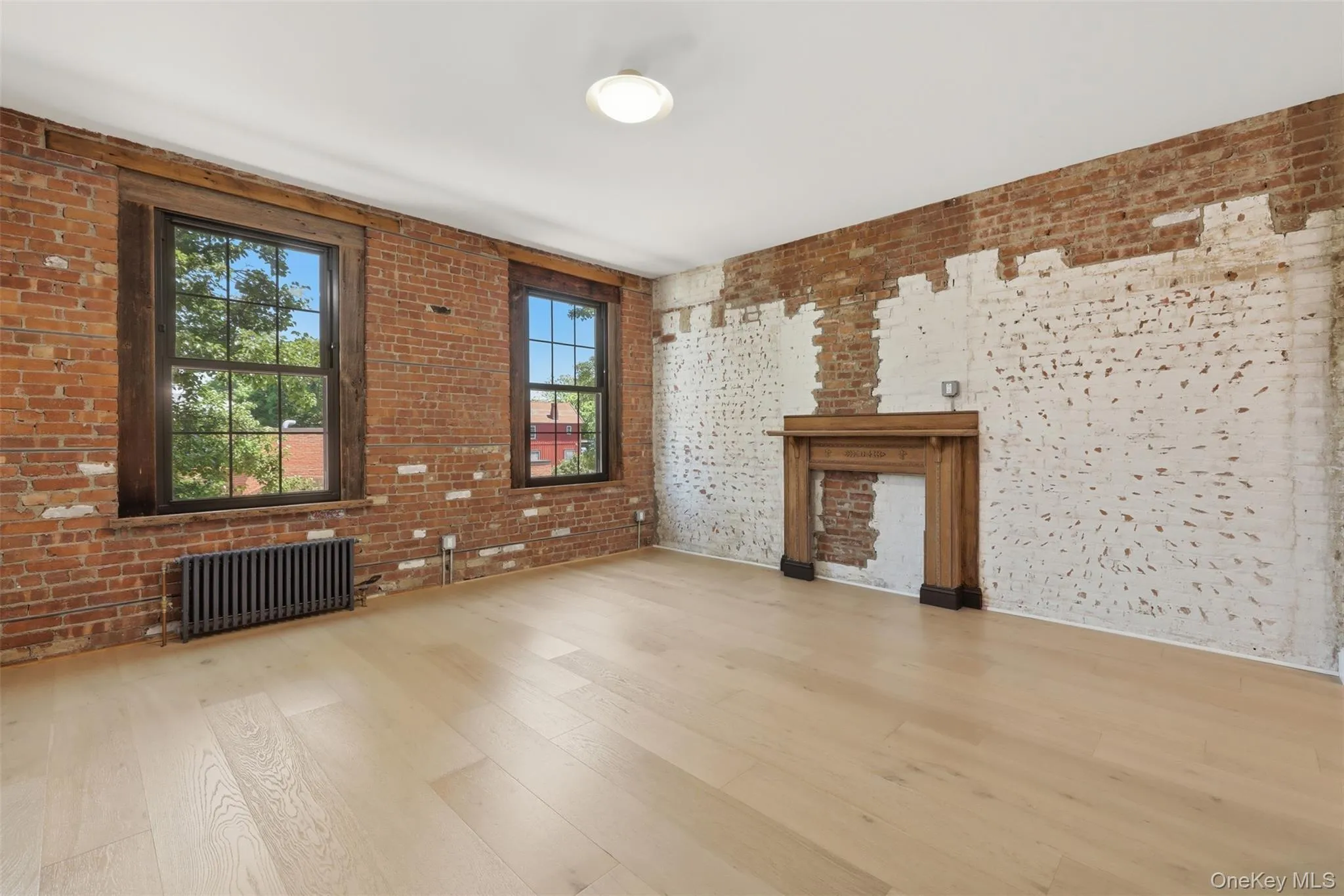 Living Room with Hardwood Floors, Exposed Brick Decorative Fireplace Mantel Living Room with Hardwood Floors, Exposed Brick Decorative Fireplace Mantel
