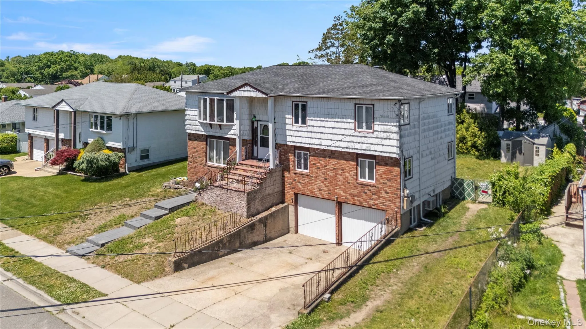 Three-story residence featuring a brick and siding exterior Three-story residence featuring a brick and siding exterior