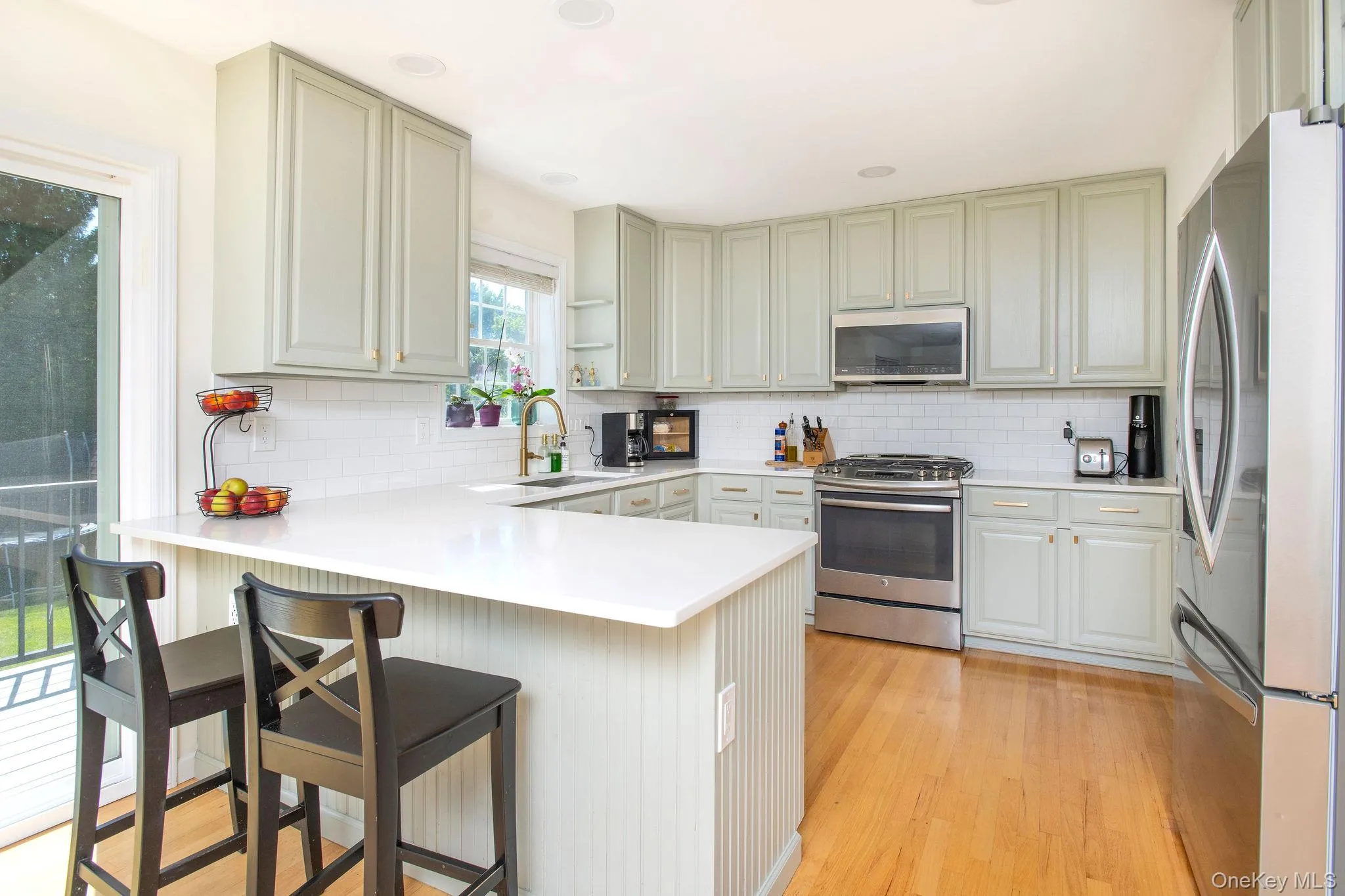 Updated kitchen with quartz countertops, stainless steel appliances, pantry, and mudroom. Updated kitchen with quartz countertops, stainless steel appliances, pantry, and mudroom.