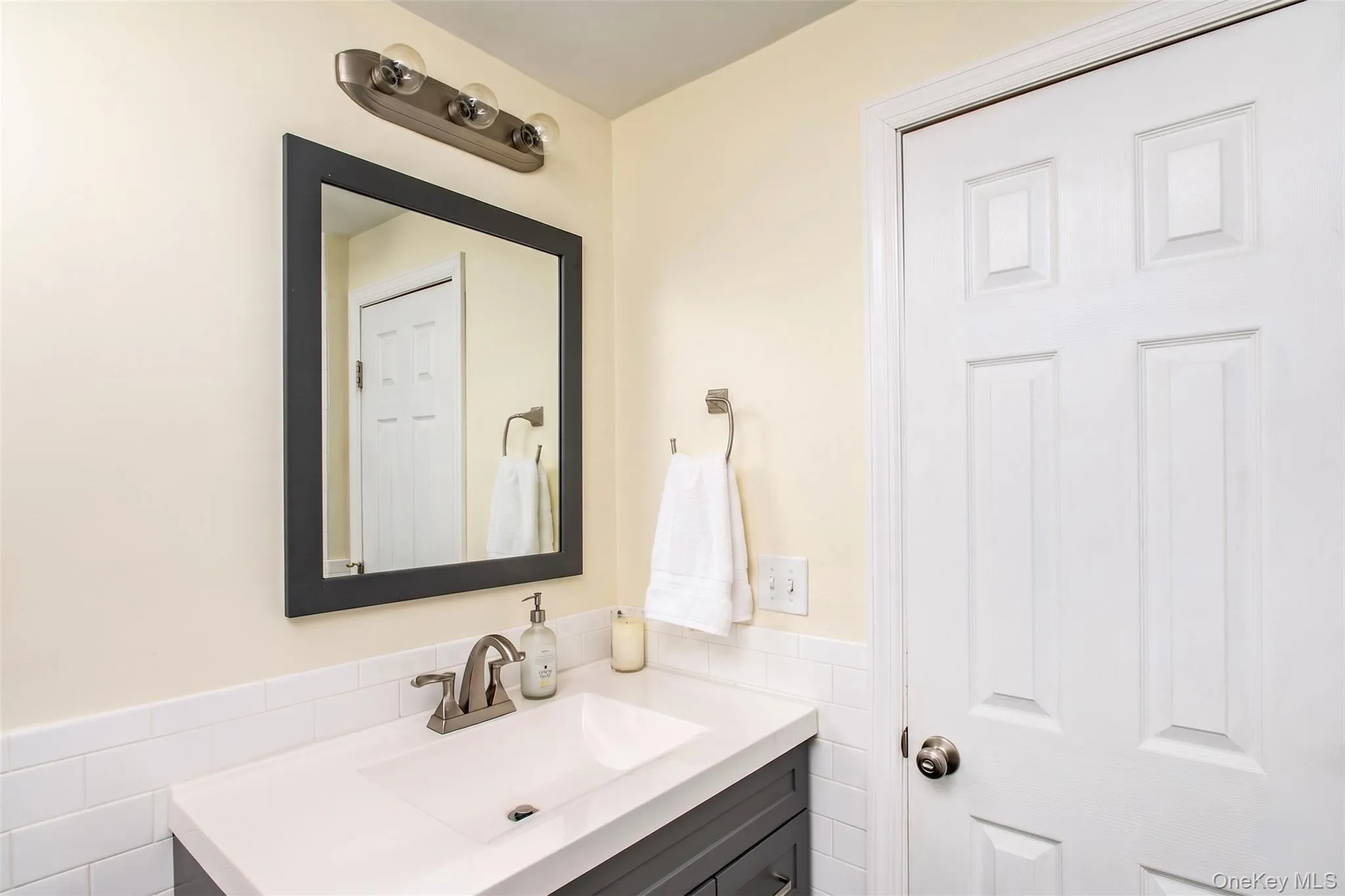 Lower level full bath with shower. Lower level full bath with shower.