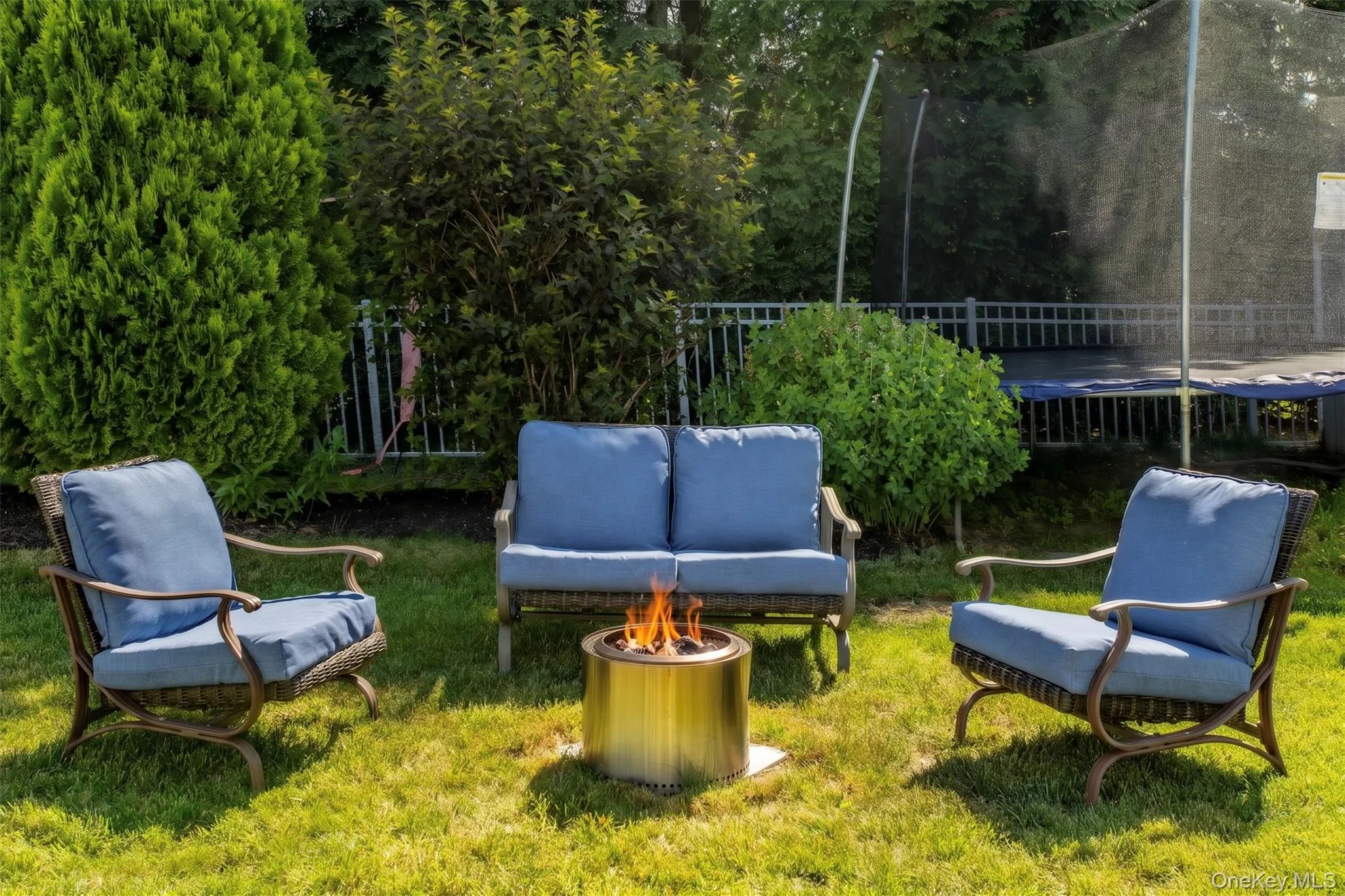 Generous backyard retreat with mature landscaping, a fire pit, storage shed, and swing set. Fire is virtually enhanced. Generous backyard retreat with mature landscaping, a fire pit, storage shed, and swing set. Fire is virtually enhanced.