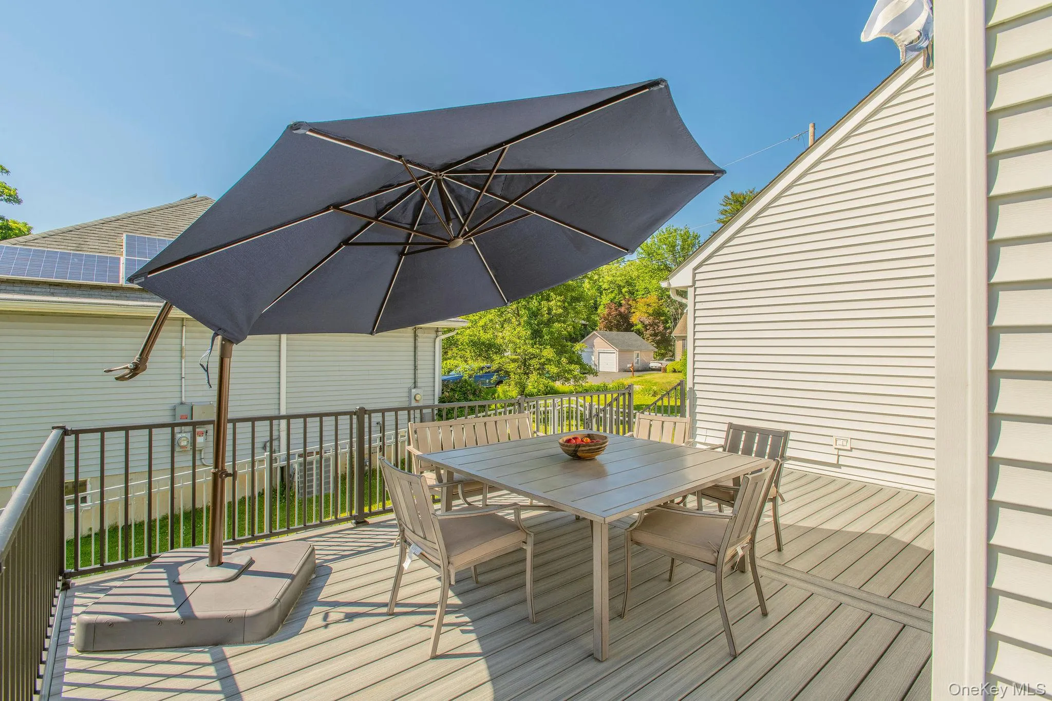 Expansive Trex decking with ample space for dining and grilling. Expansive Trex decking with ample space for dining and grilling.