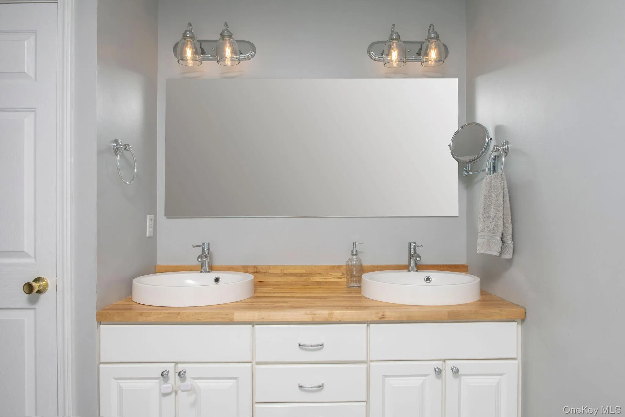 En suite primary bathroom with double vanity, full shower and bath. En suite primary bathroom with double vanity, full shower and bath.