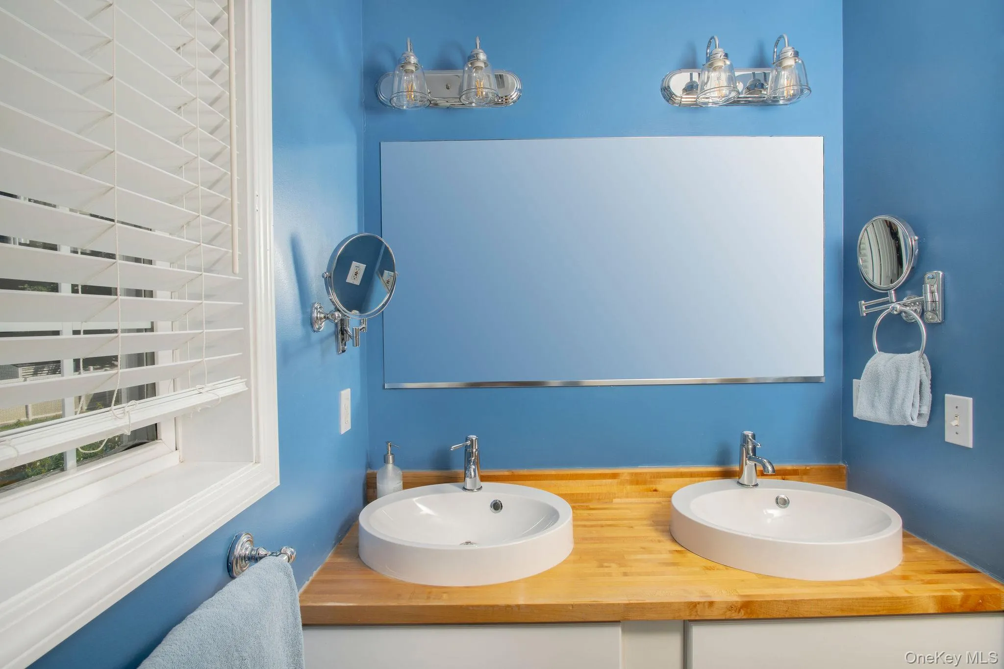 Second floor full bath with double vanity and shower with tub. Second floor full bath with double vanity and shower with tub.